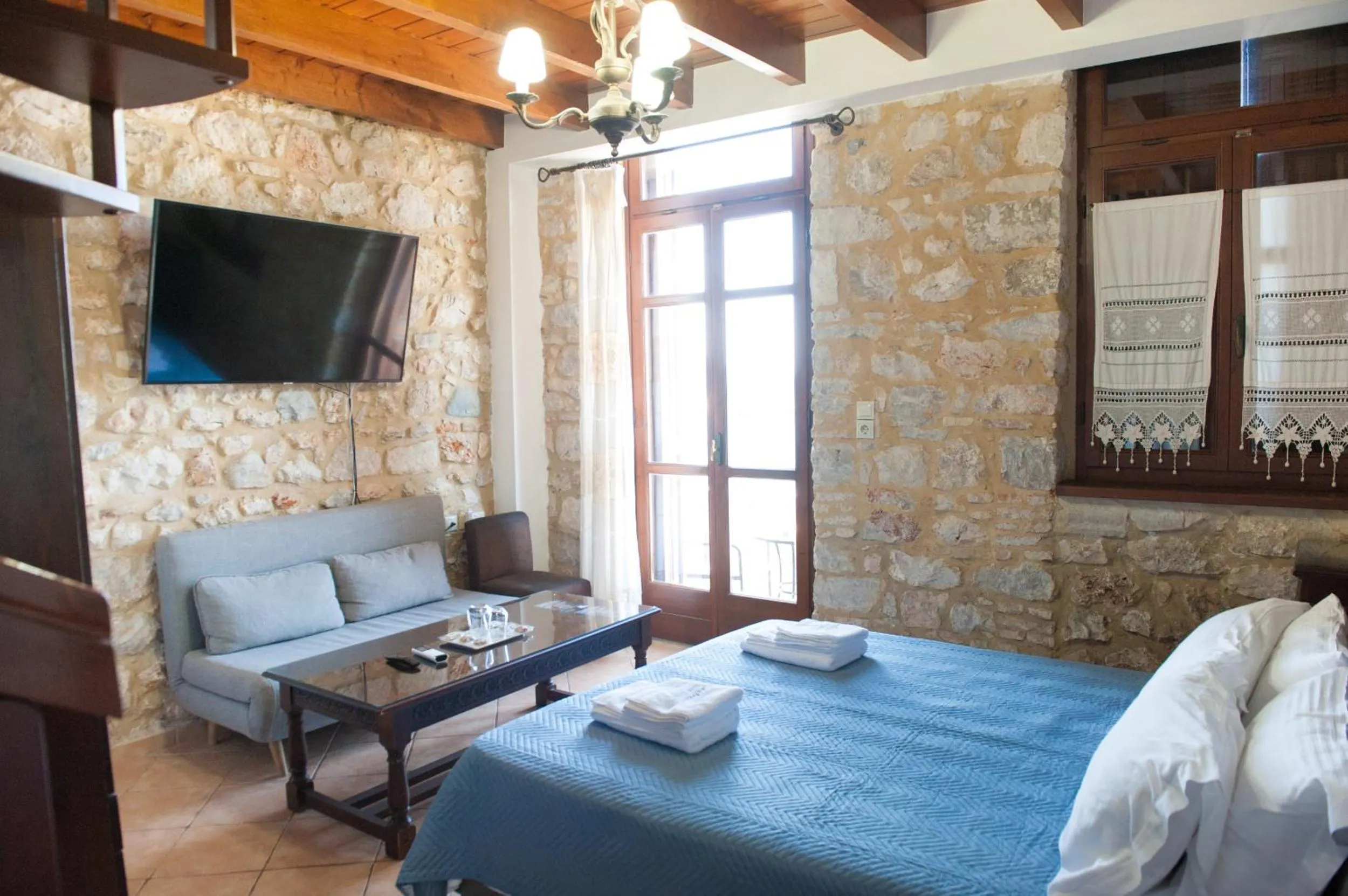 Photo of the whole room, Bed in SeaFront Stone Suites