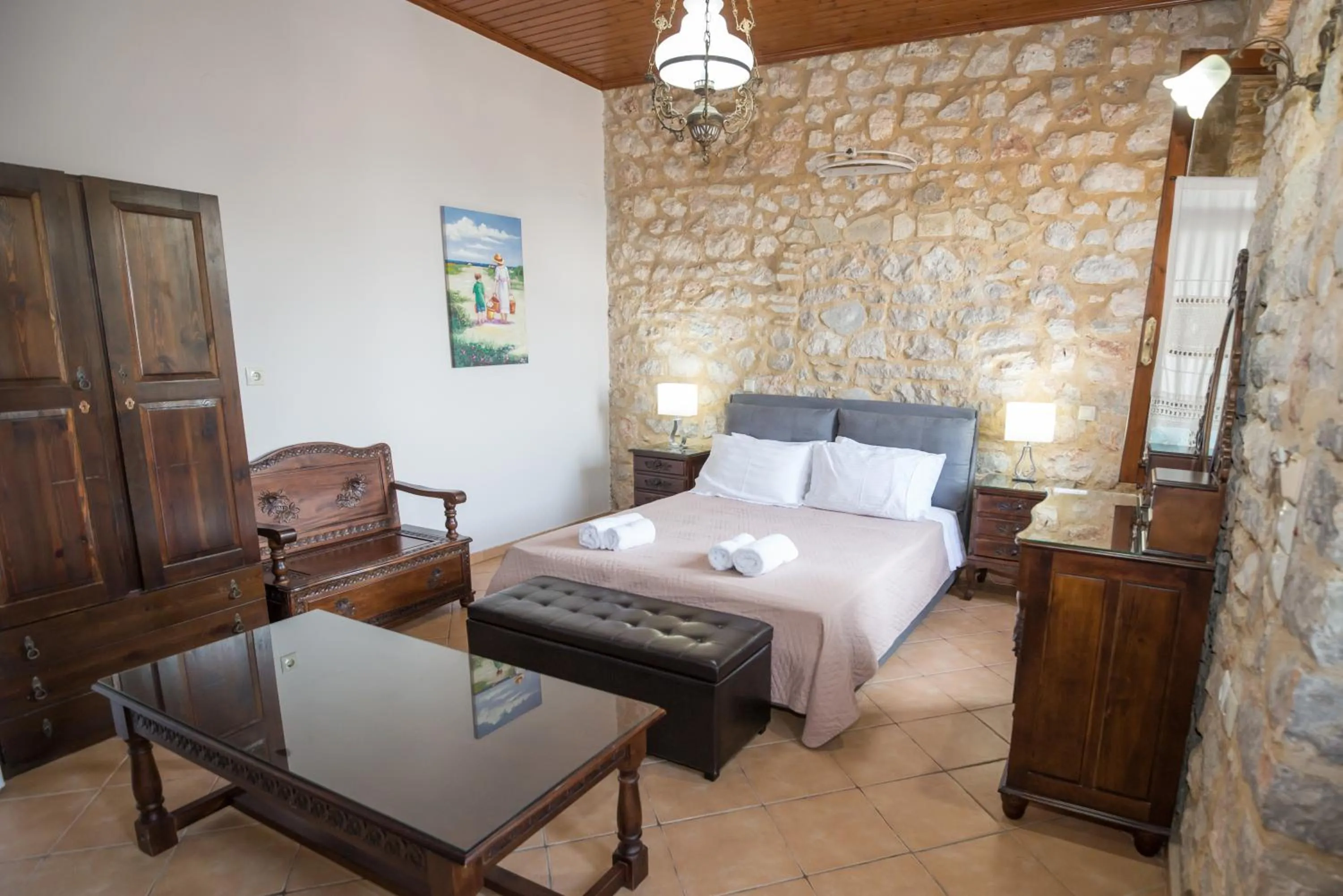 Photo of the whole room, Bed in SeaFront Stone Suites