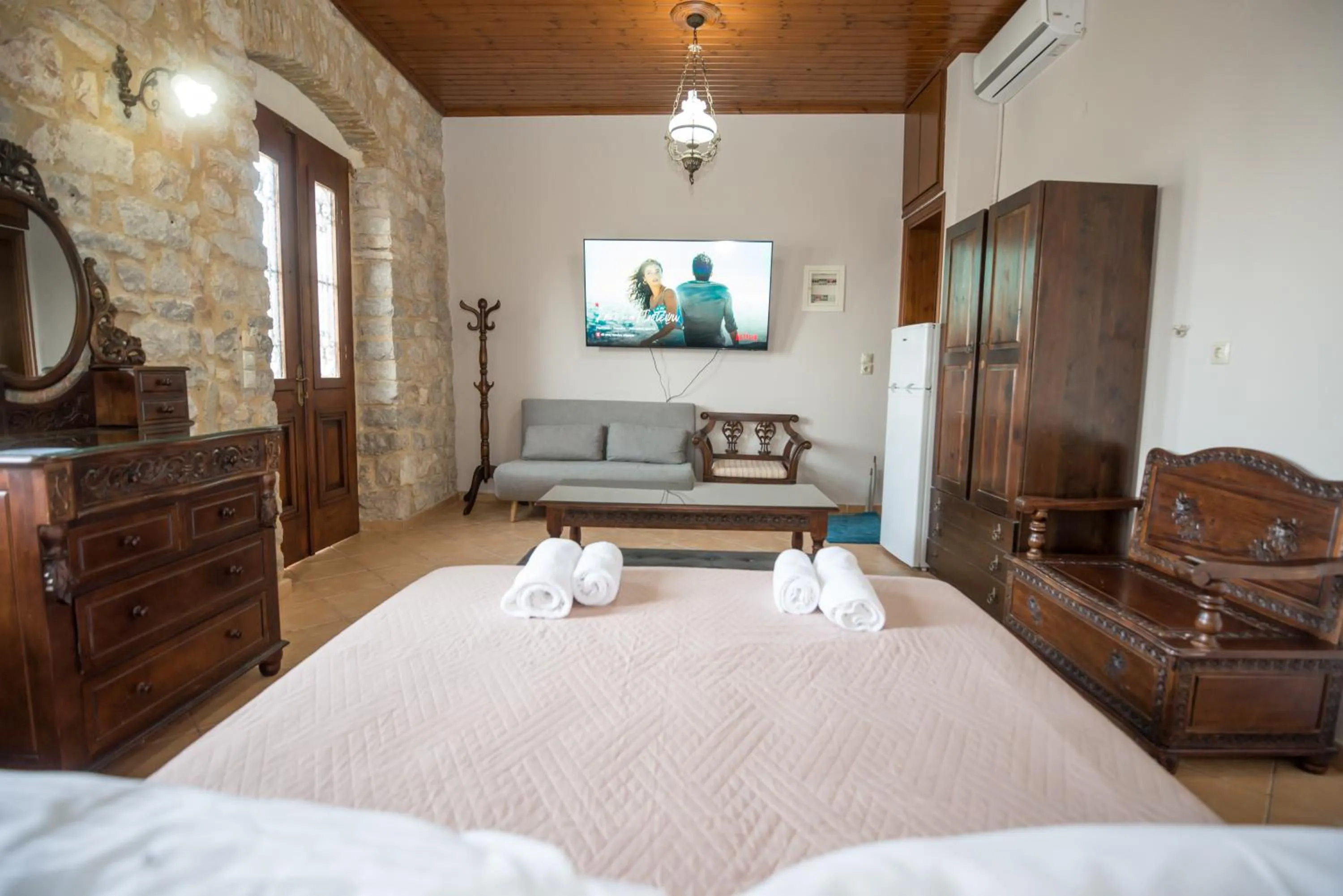 Photo of the whole room, Bed in SeaFront Stone Suites