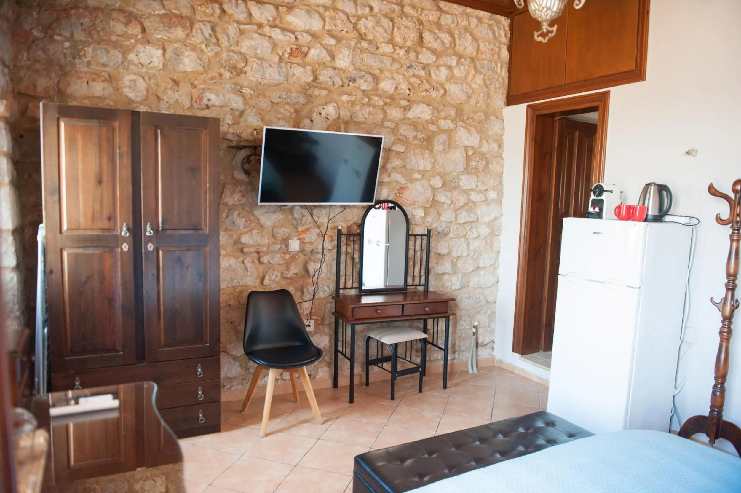 Photo of the whole room, Bed in SeaFront Stone Suites