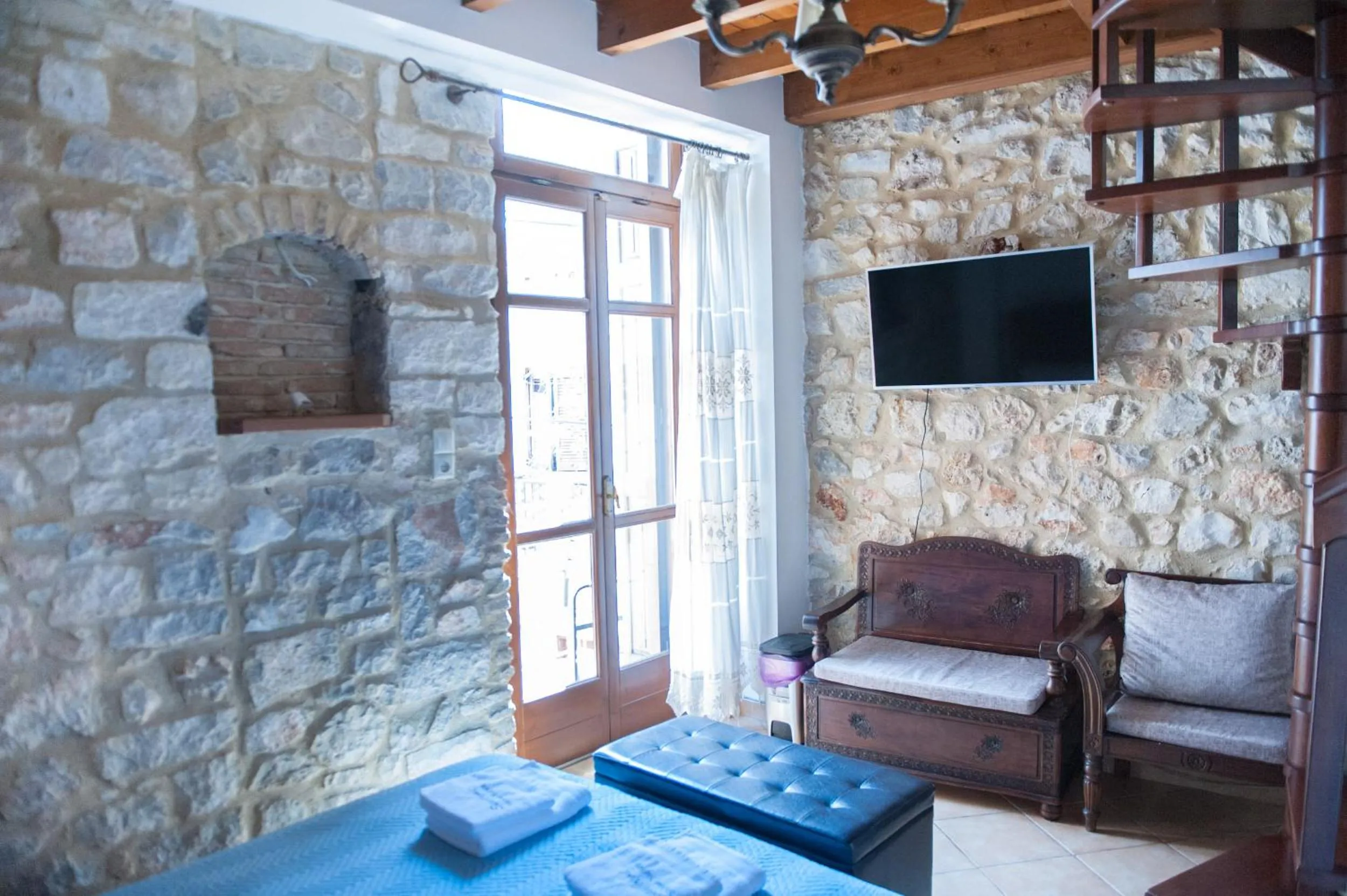Photo of the whole room, Bed in SeaFront Stone Suites
