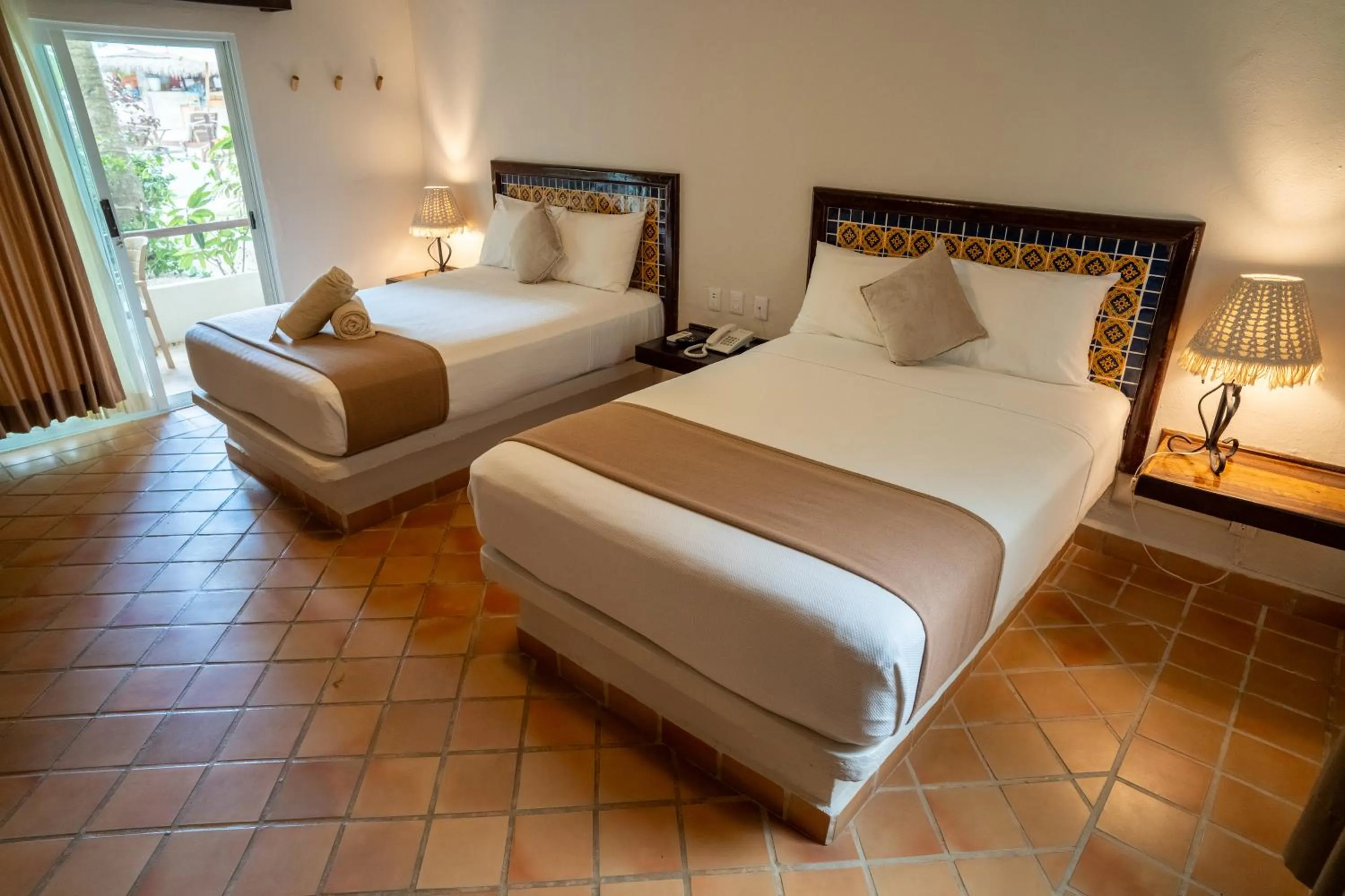 Bed in Petit Lafitte Beach Front Hotel & Bungalows