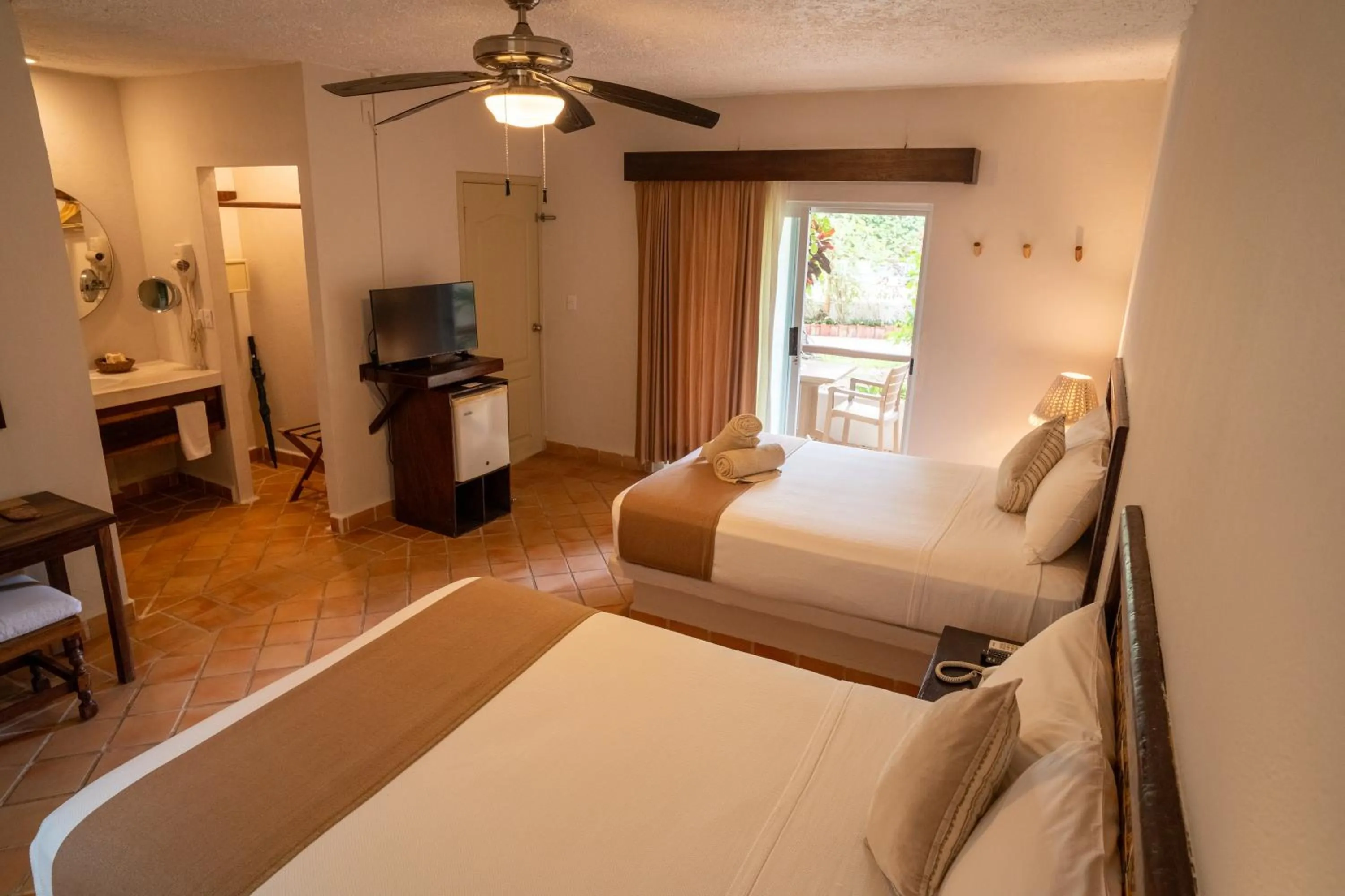 Bed in Petit Lafitte Beach Front Hotel & Bungalows