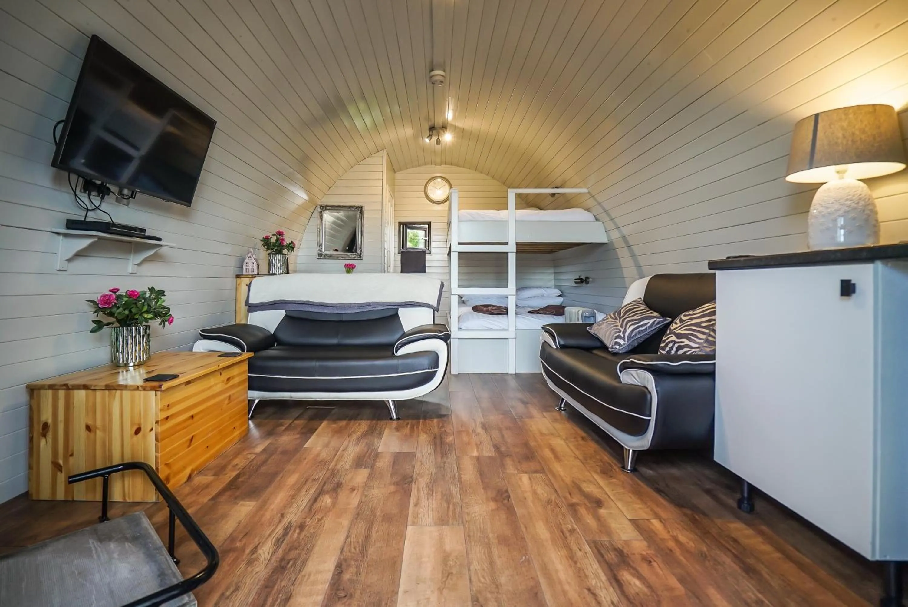Living room, Bed in Deluxe Glamping Pod with Hot Tub