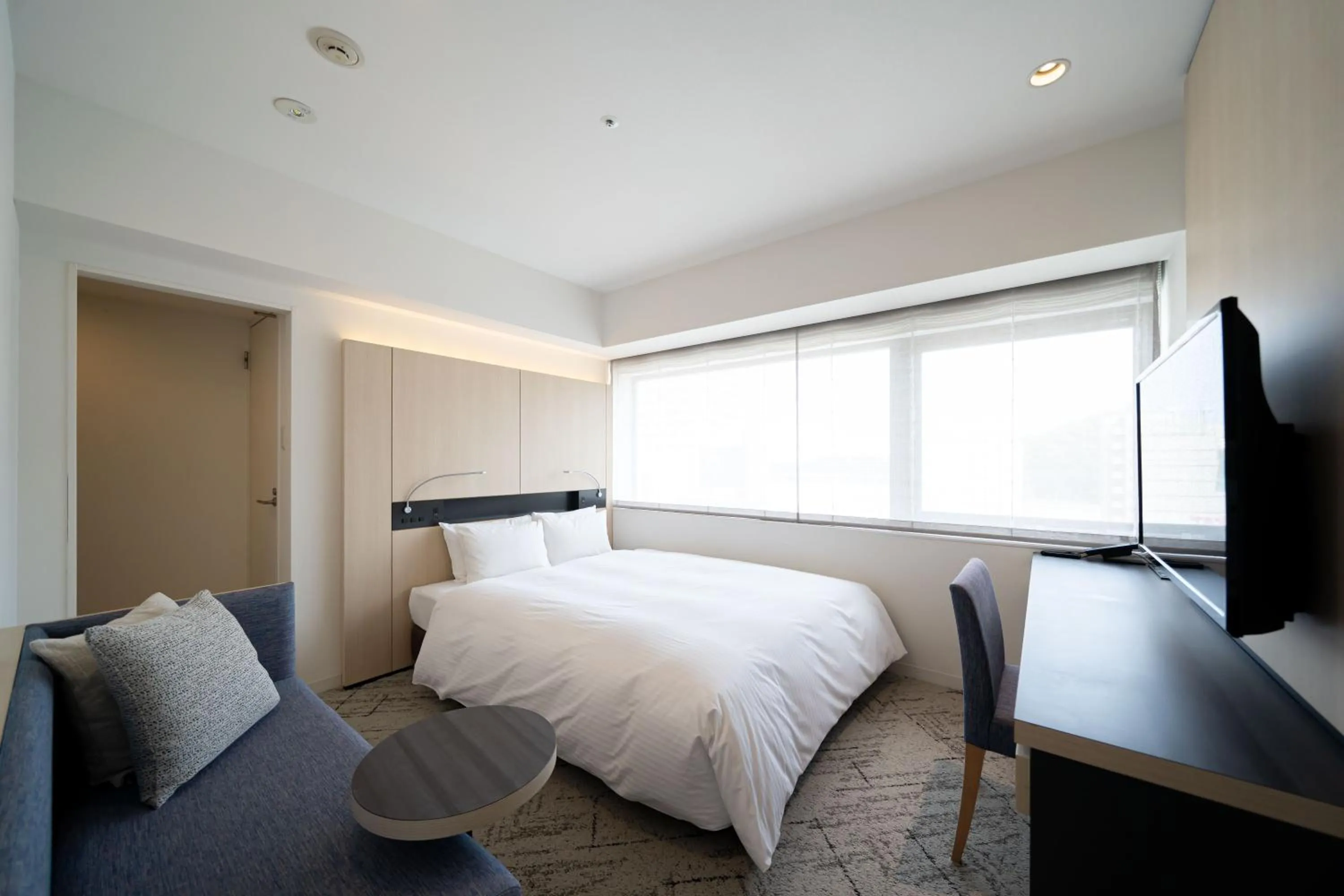 Bed in Hotel Sunroute Tokushima