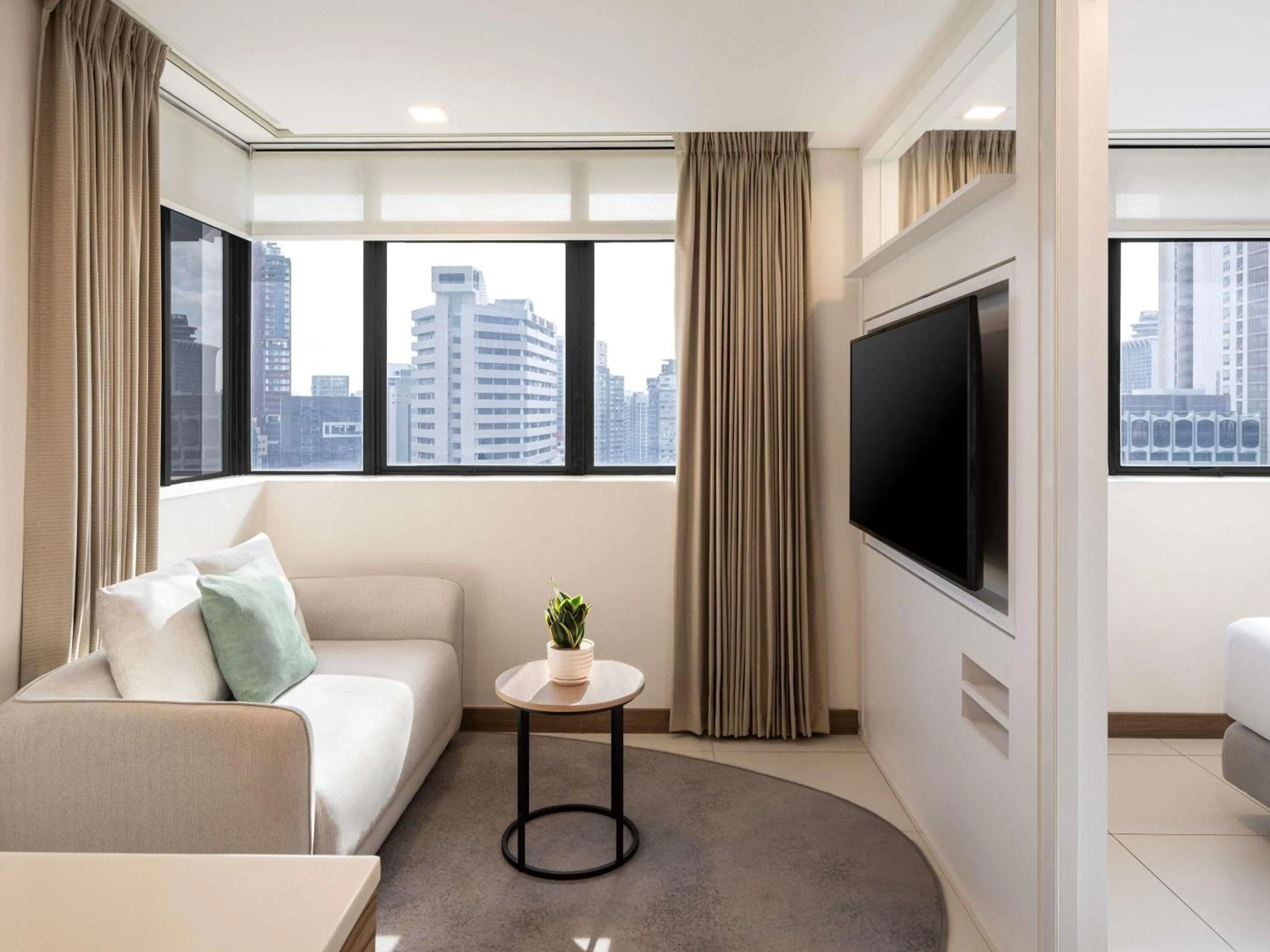 Bedroom in Novotel Living Singapore Orchard