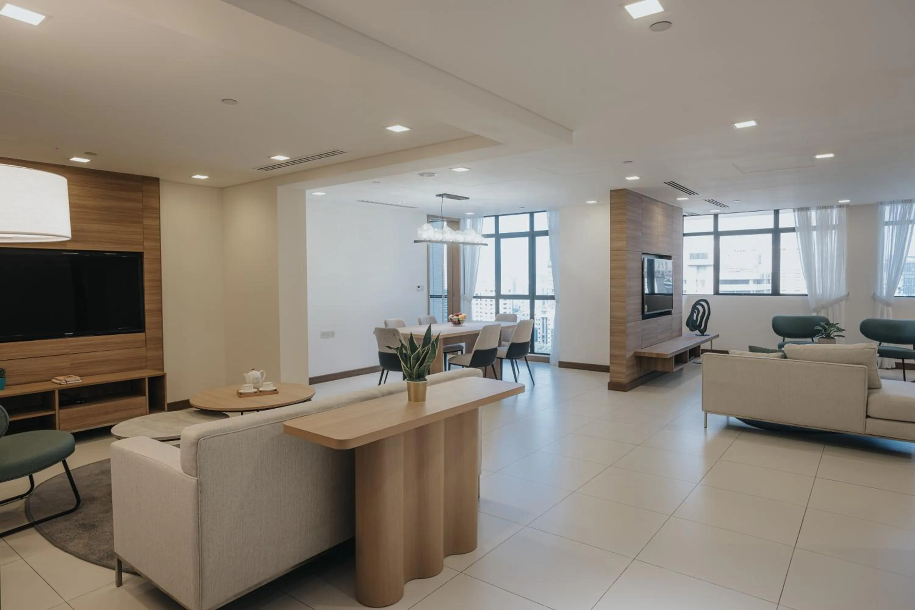 Communal lounge/ TV room in Novotel Living Singapore Orchard