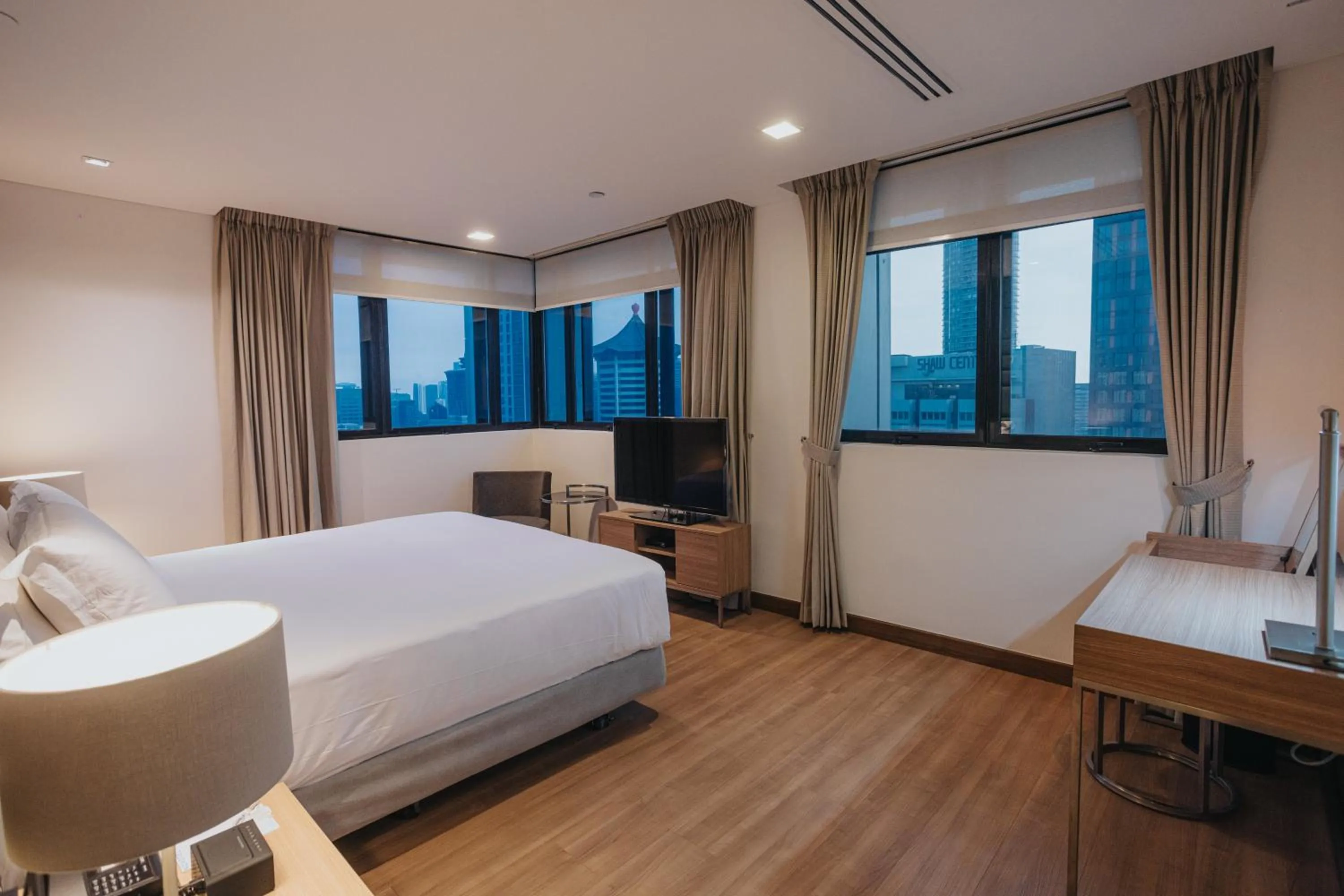Photo of the whole room, Bed in Novotel Living Singapore Orchard