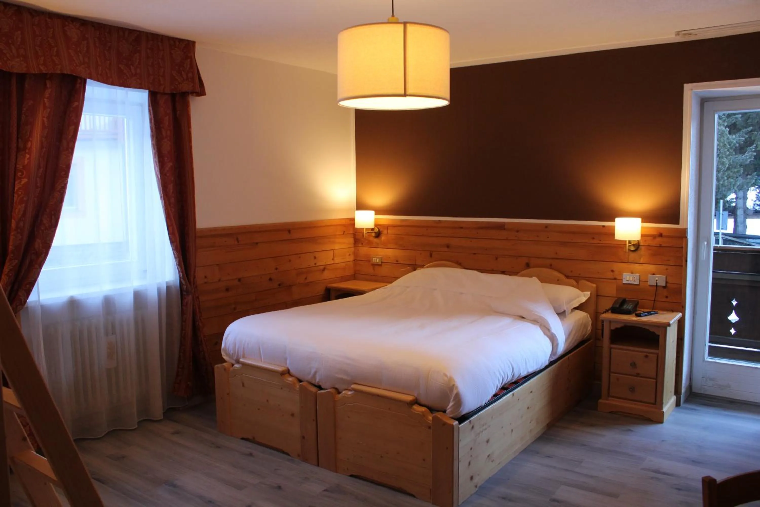 Bed in Hotel Rododendro Val di Fassa