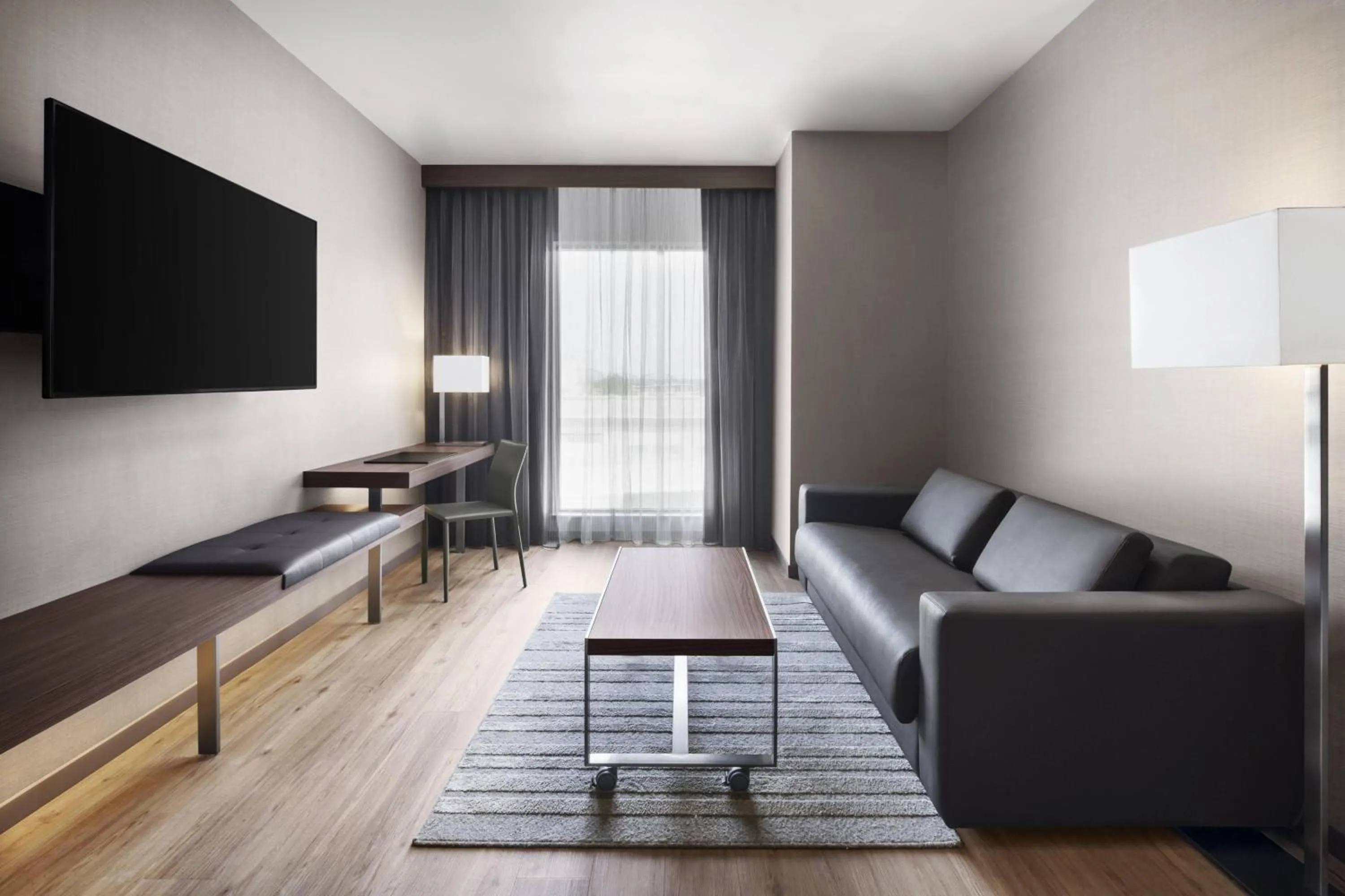 Living room in AC Hotel by Marriott Louisville Downtown