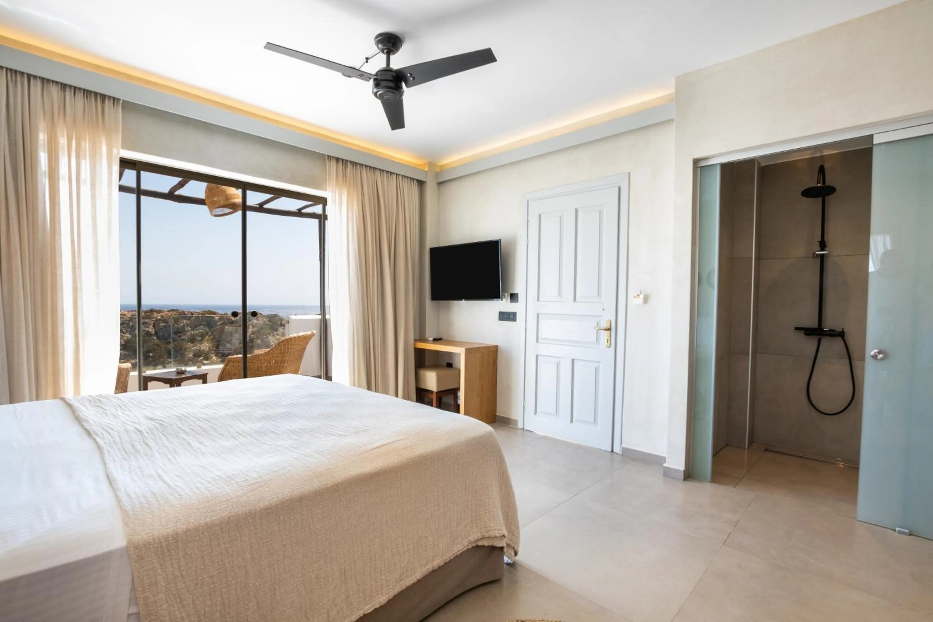 Bed in Aegean Village Beachfront Resort