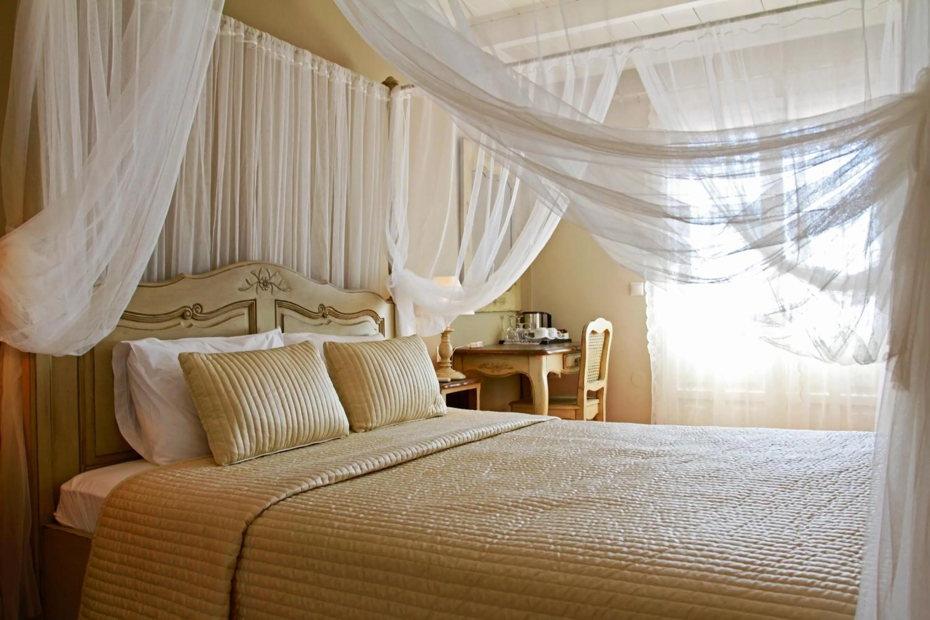 Bed in Aegean Village Beachfront Resort