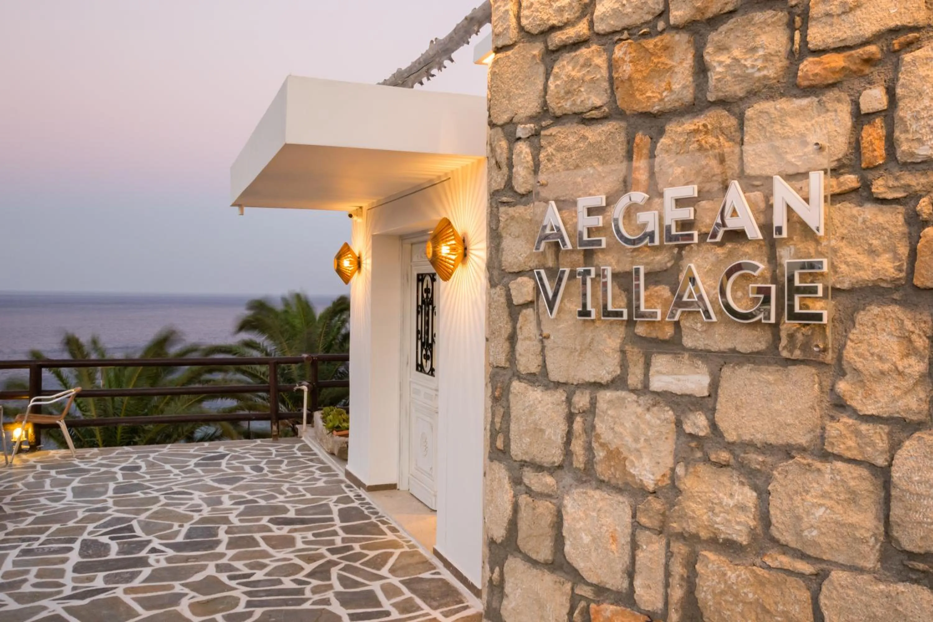Property logo or sign in Aegean Village Beachfront Resort