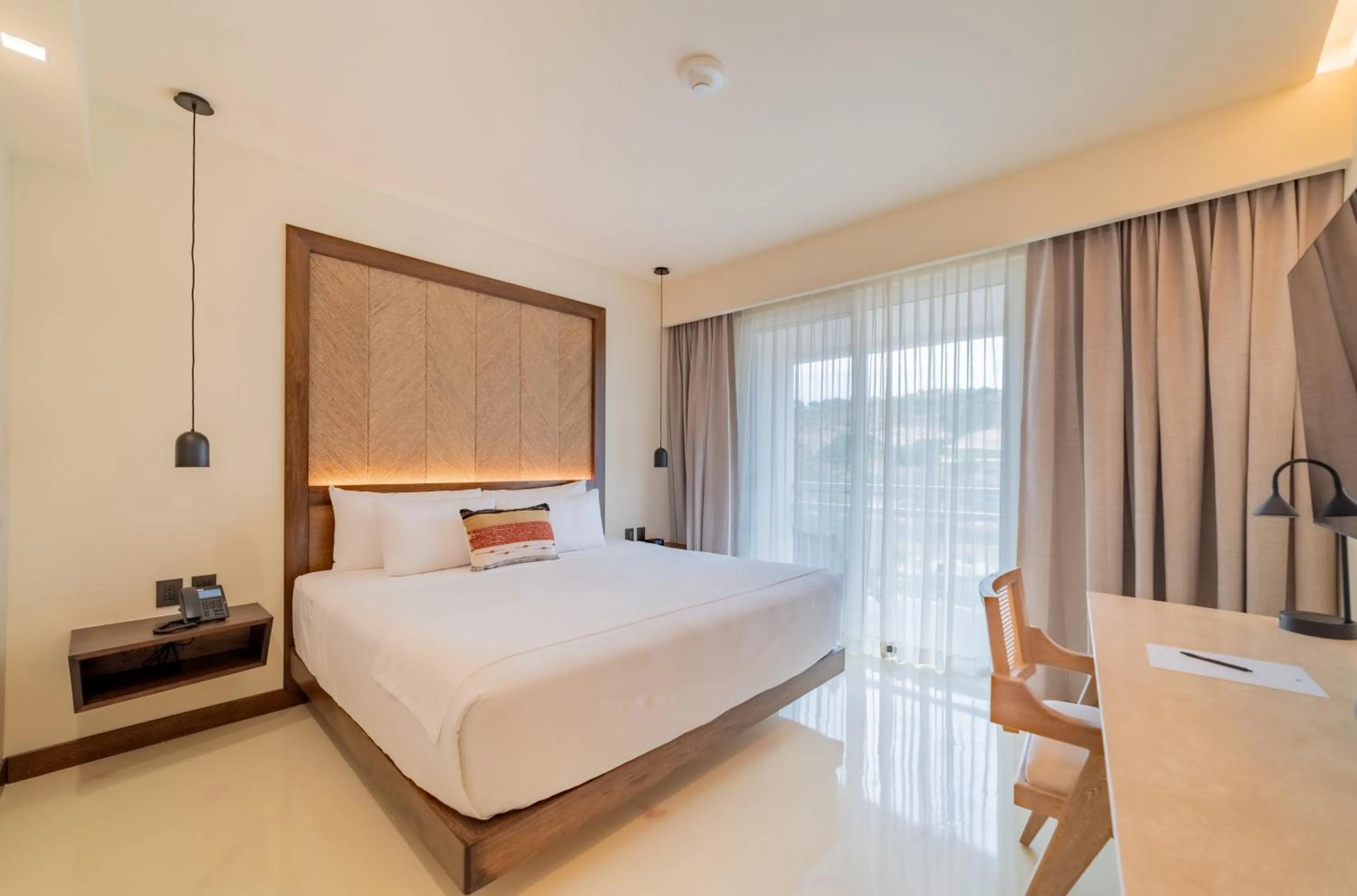 Photo of the whole room, Bed in Hotel Indigo La Paz Puerta Cortes by IHG