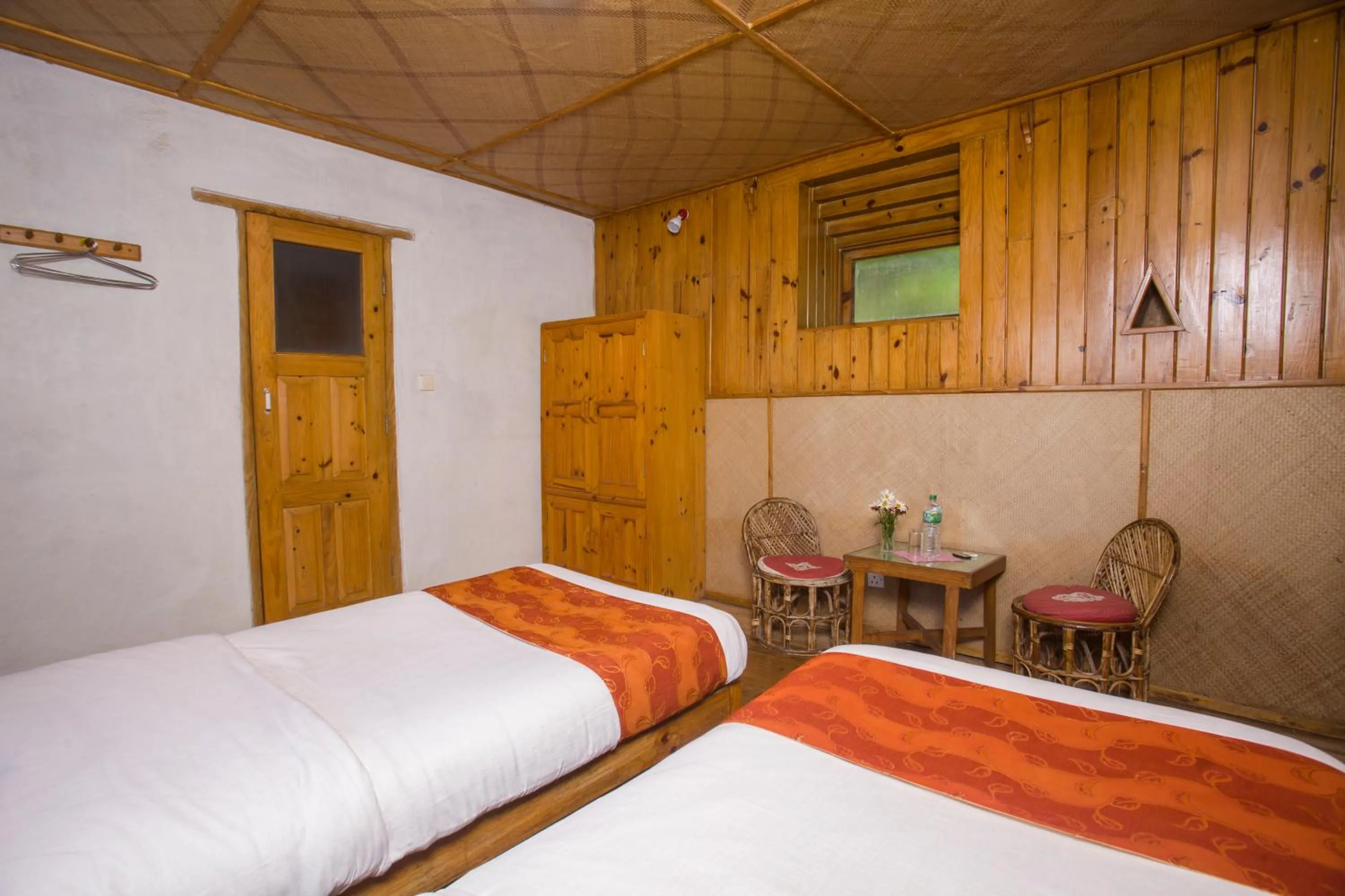 Photo of the whole room, Bed in Everest Manla Resort