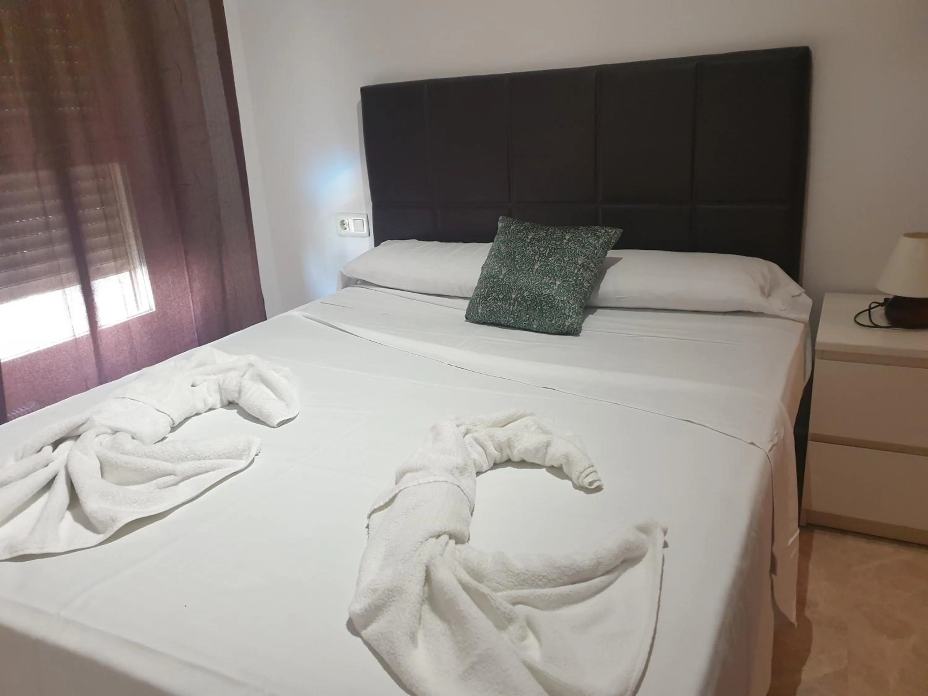 Bed in Oceanográfico Apartments