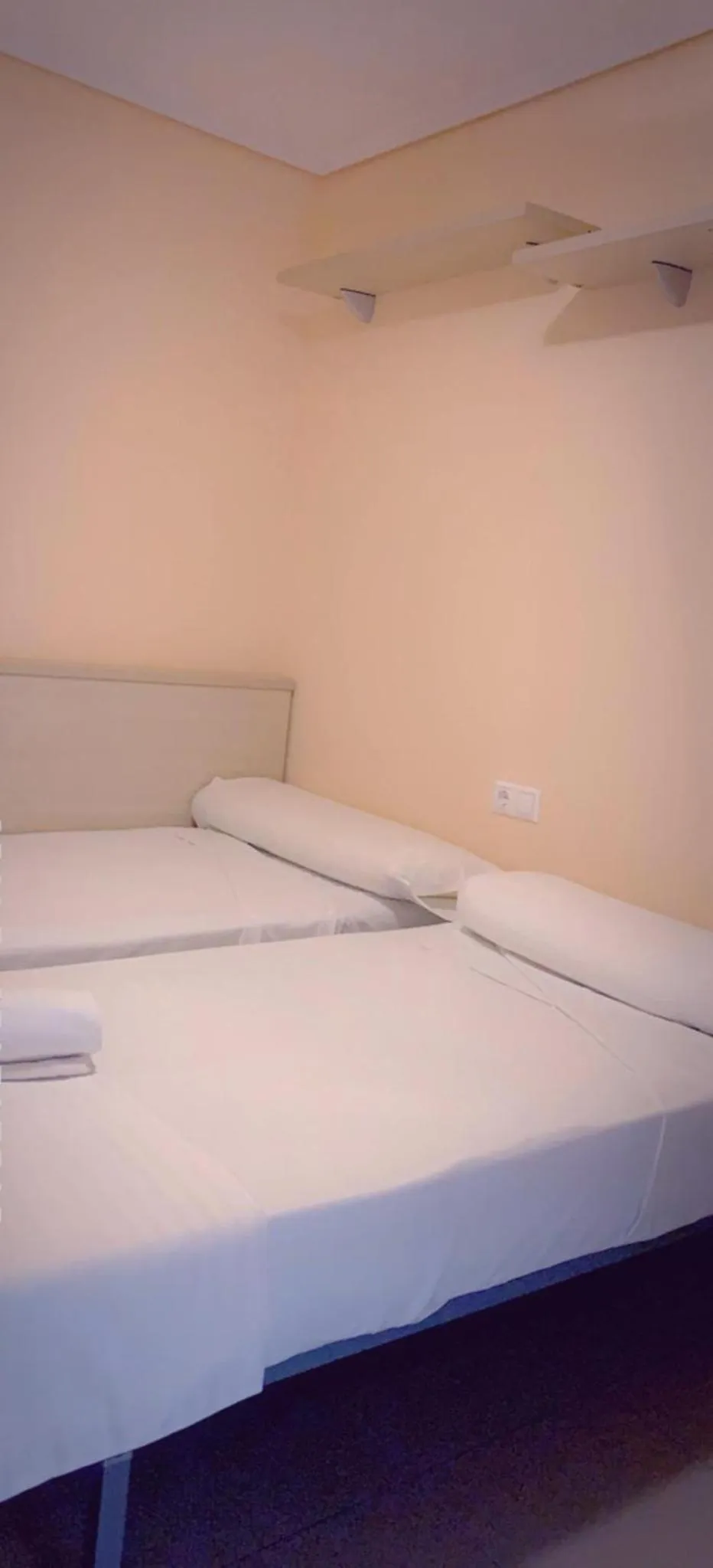 Bed in Oceanográfico Apartments