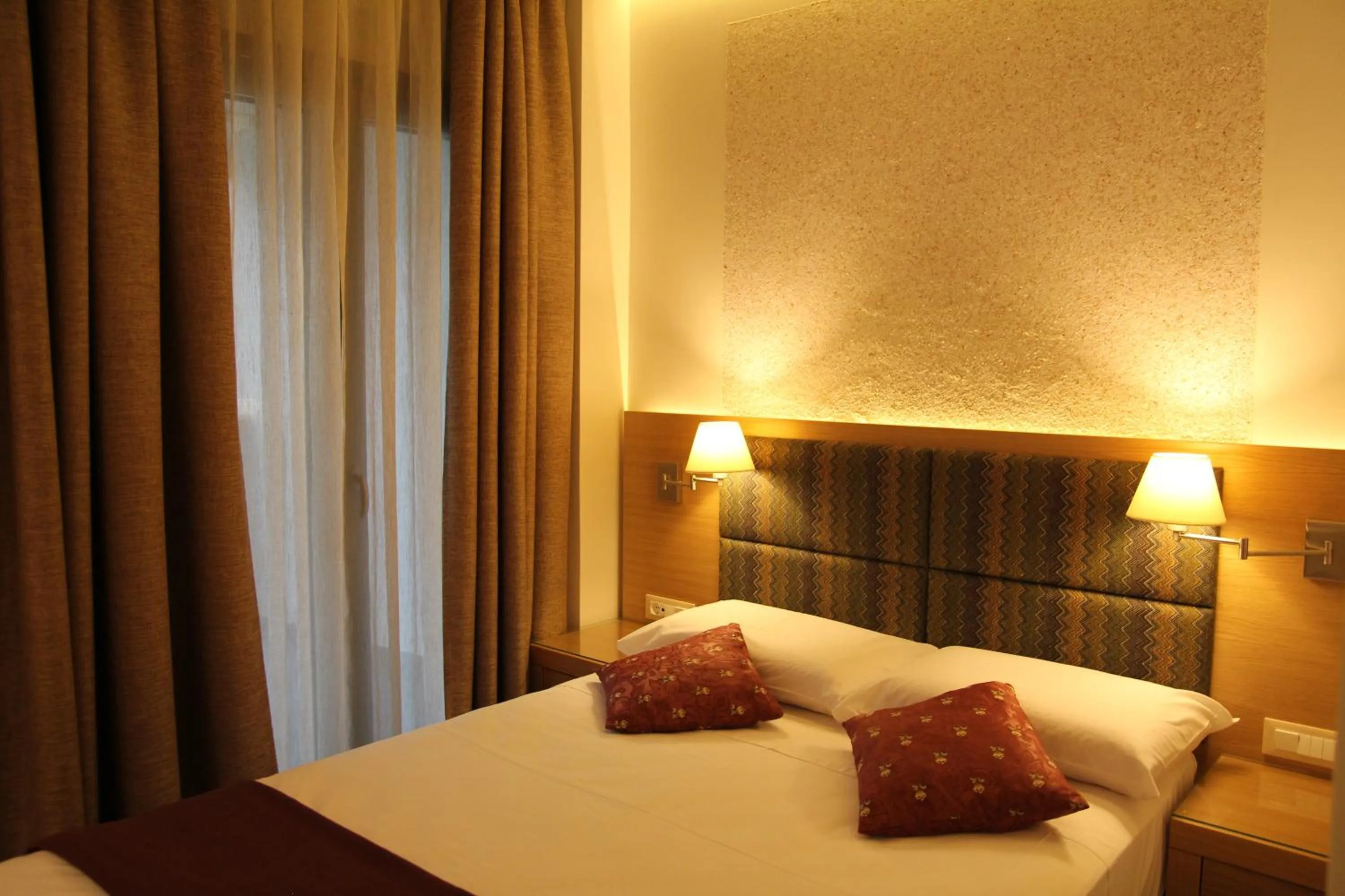 Bed in Achilles Hotel