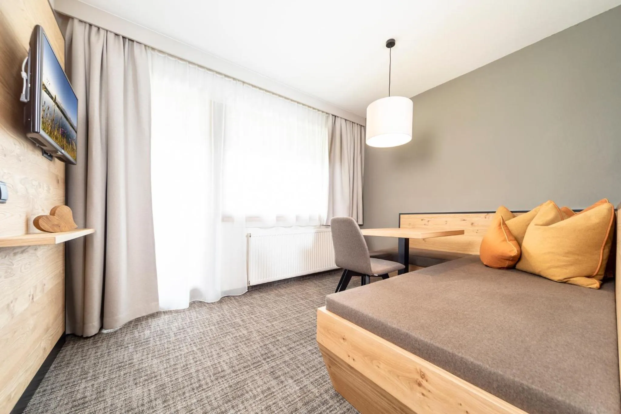 Seating area, Bed in Hotel Stockerwirt