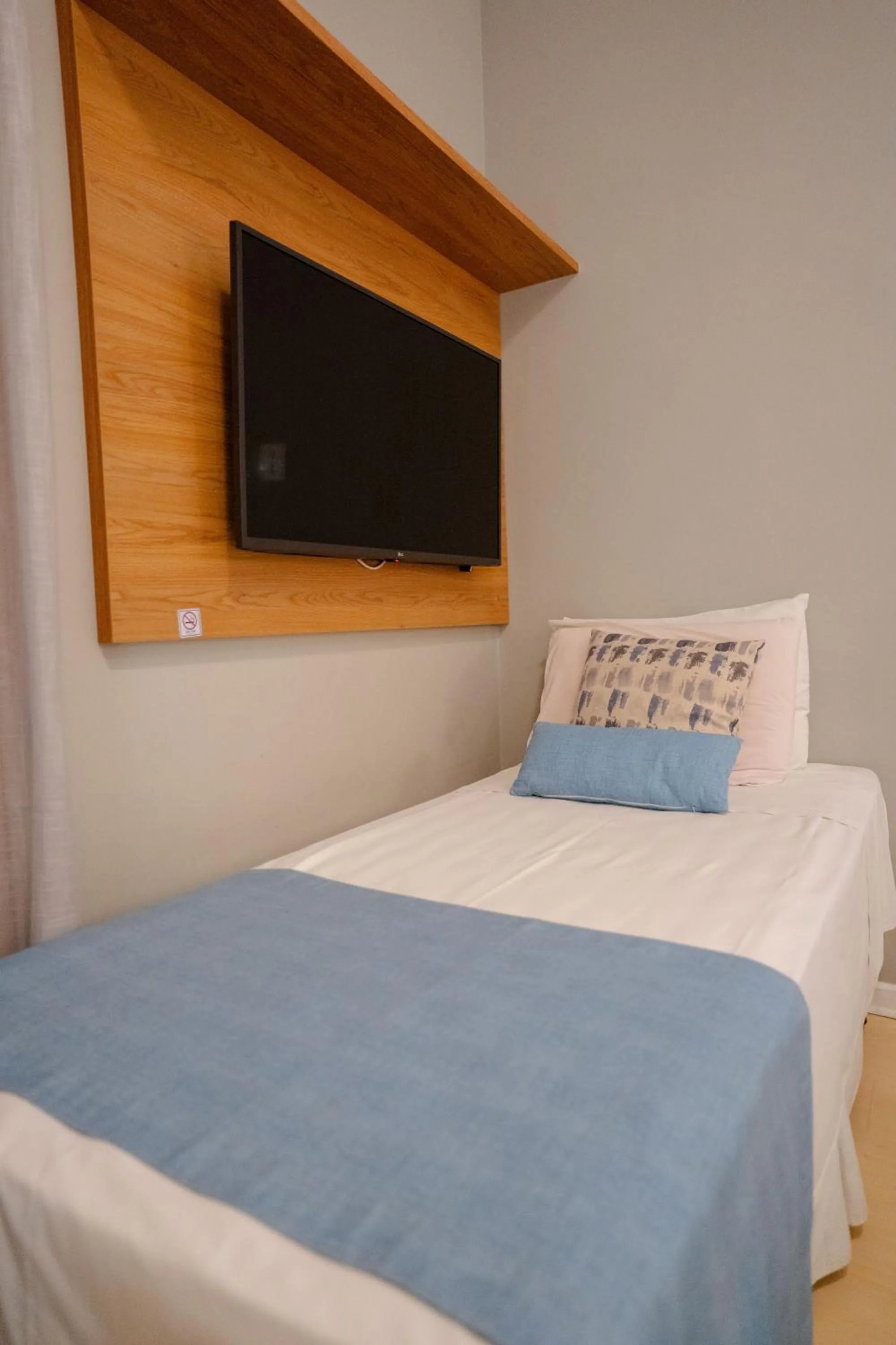 Bed in Hotel Minas Gerais