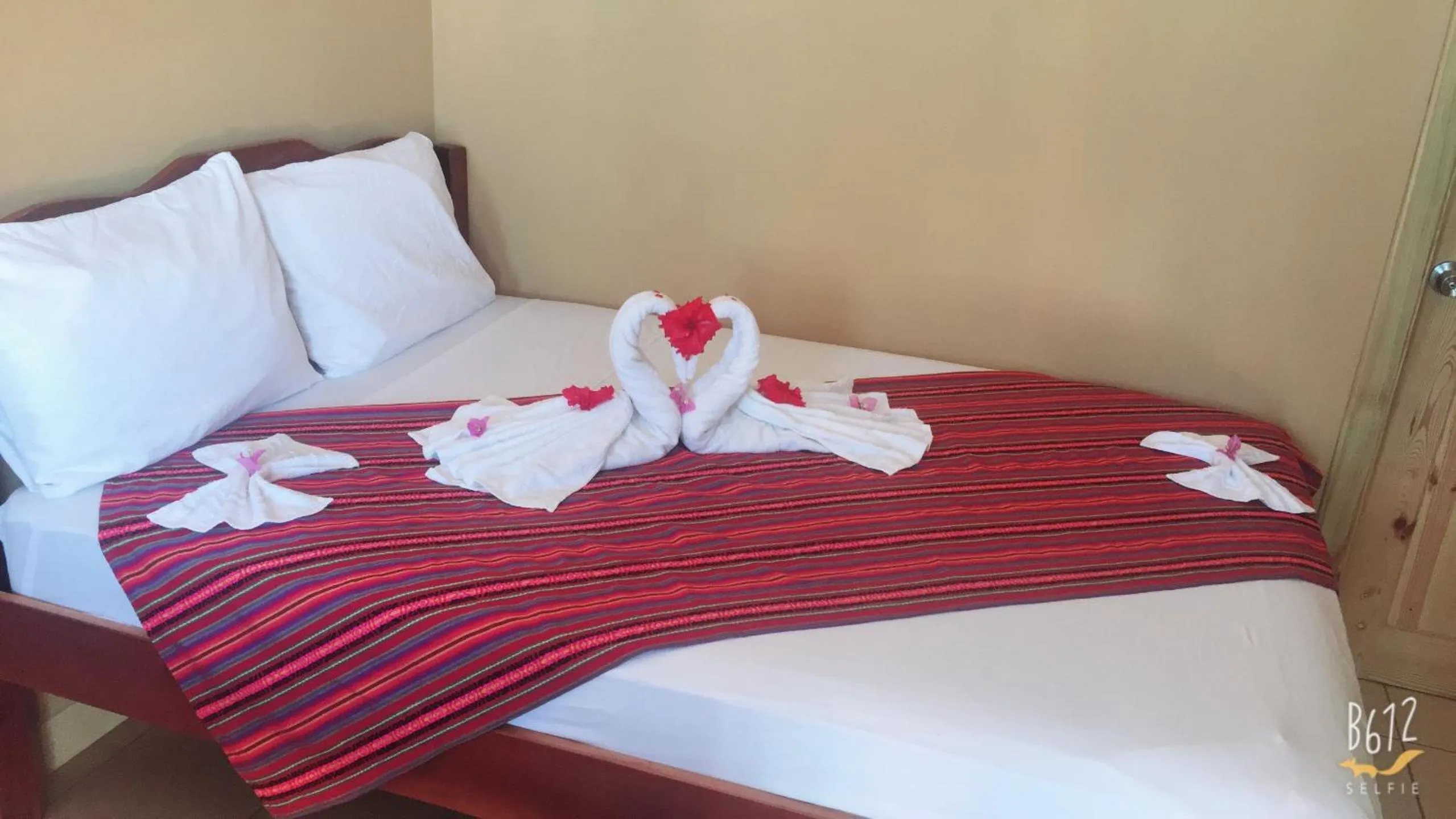 Bed in Ambergris Sunset Hotel