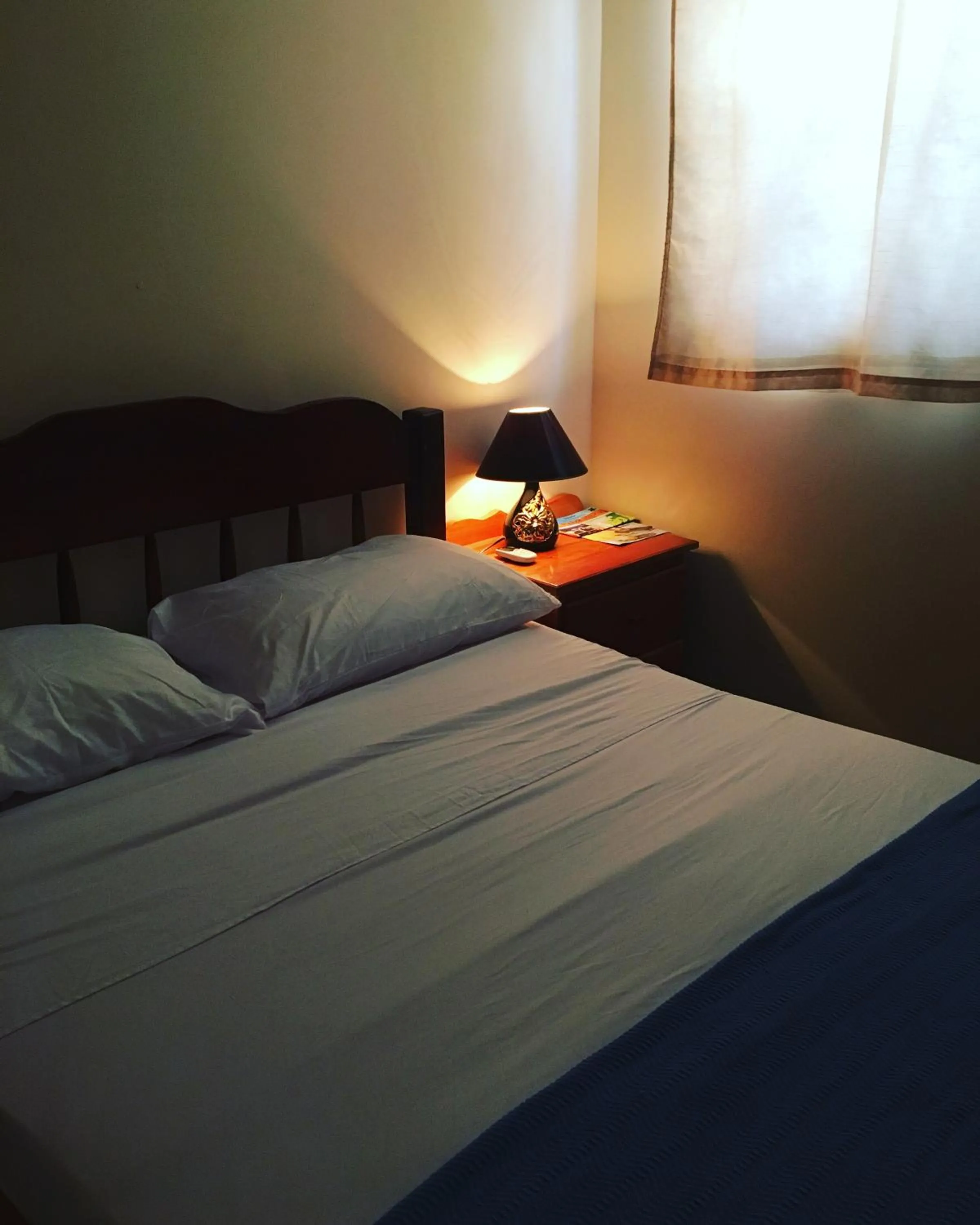 Bed in Ambergris Sunset Hotel