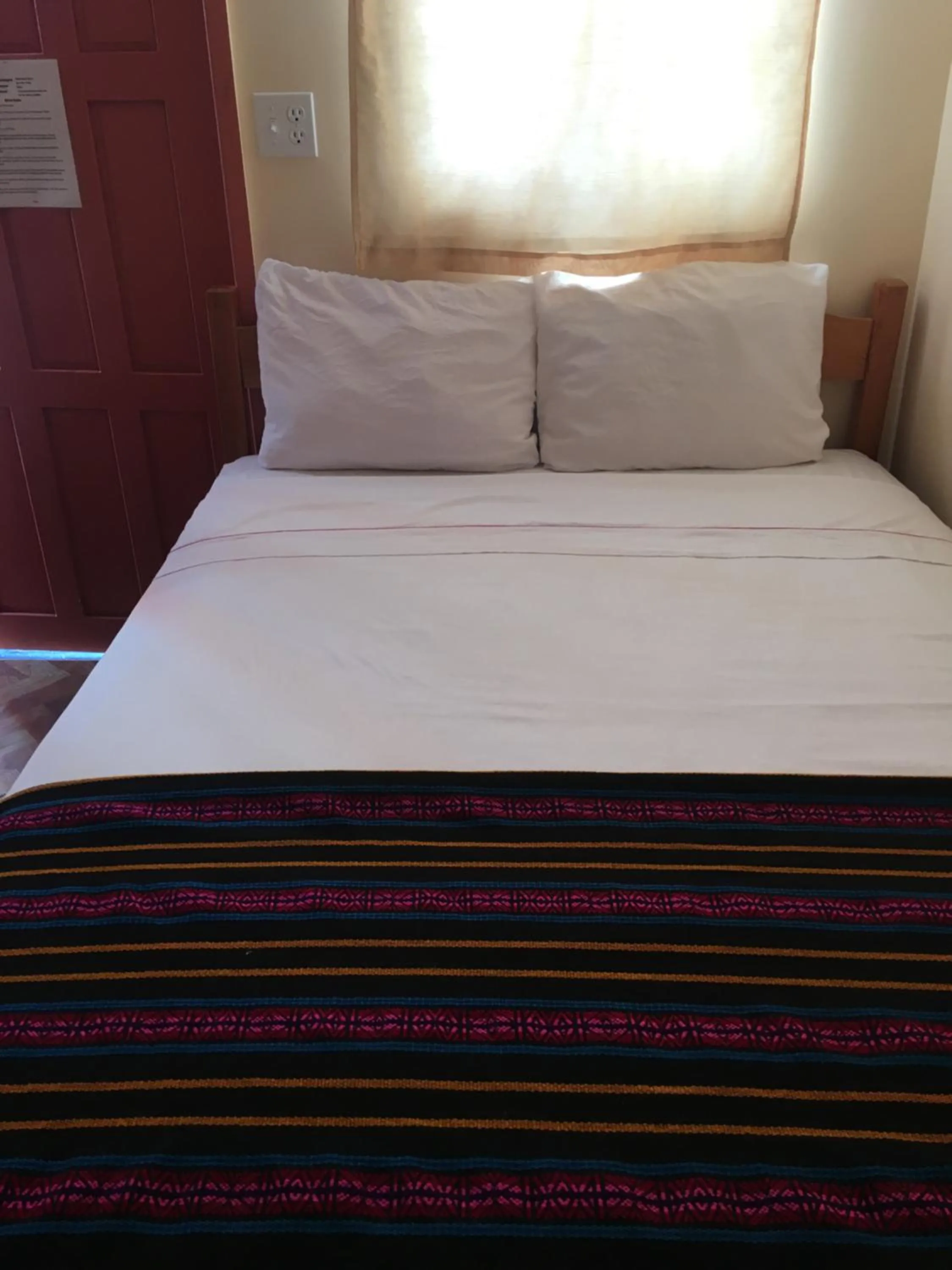 Bed in Ambergris Sunset Hotel