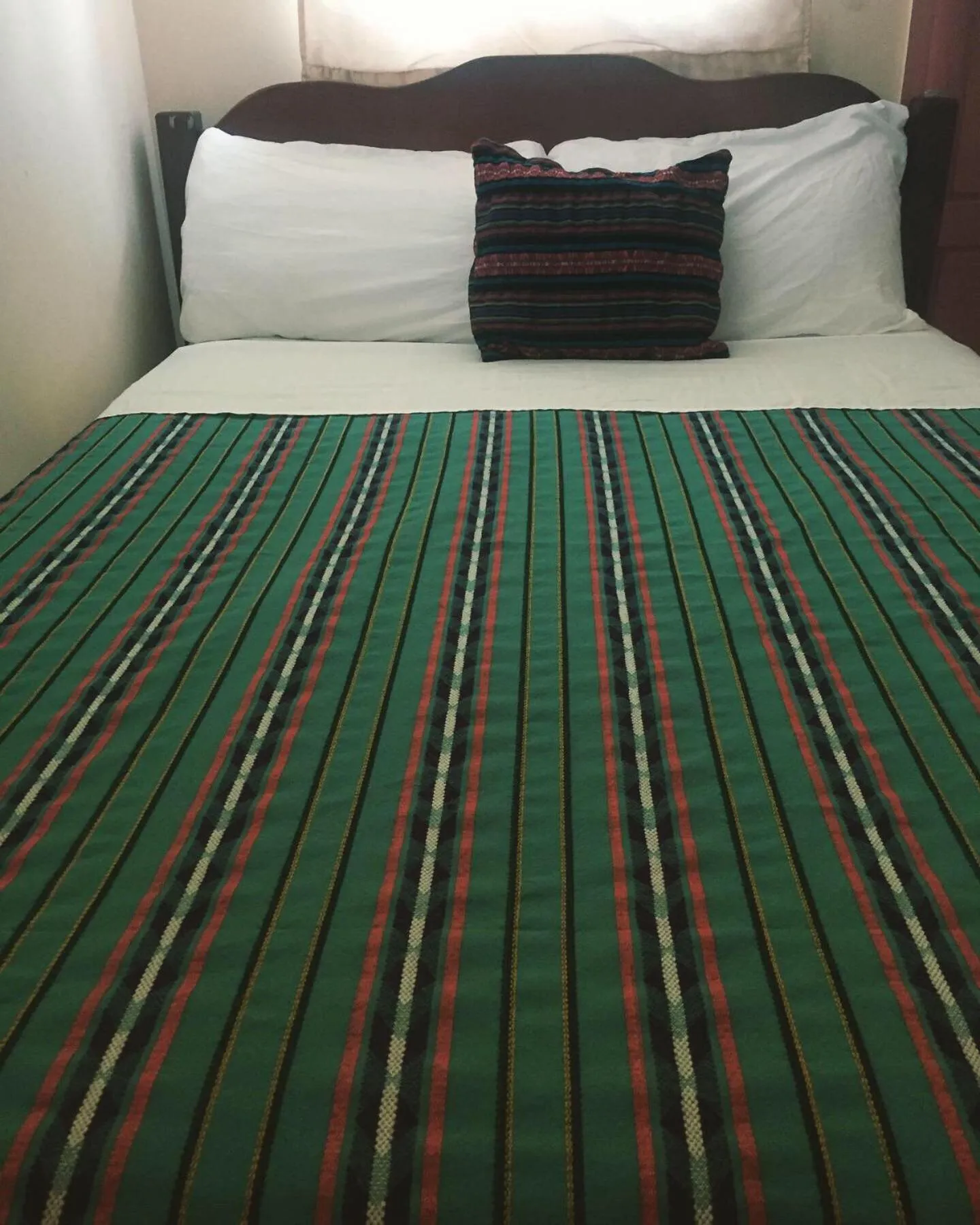 Bed in Ambergris Sunset Hotel