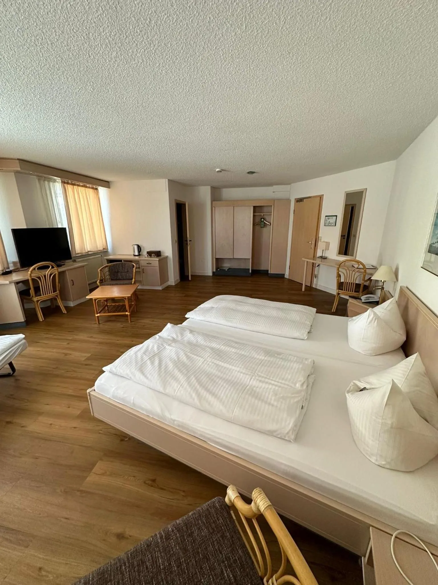 Photo of the whole room, Bed in Hotel Aichtaler Hof