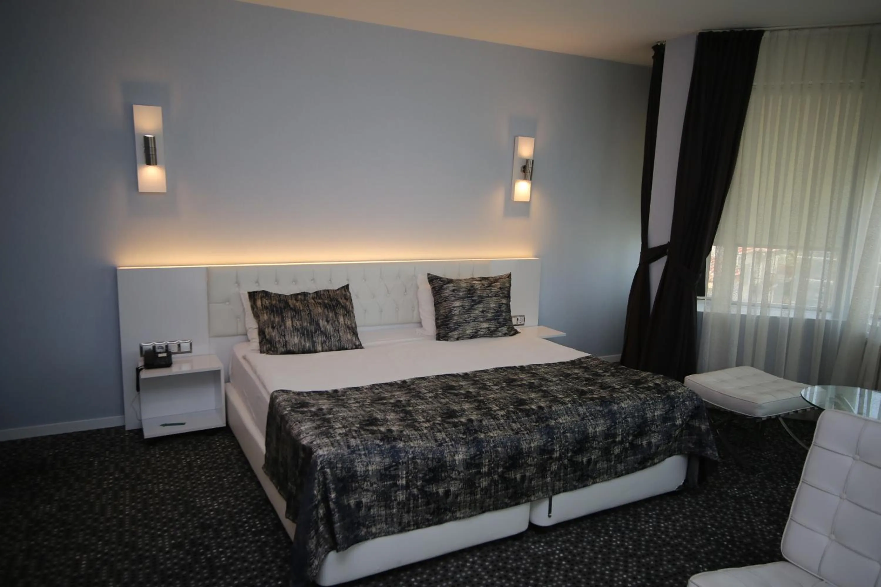 Bed in Grand Nora Hotel