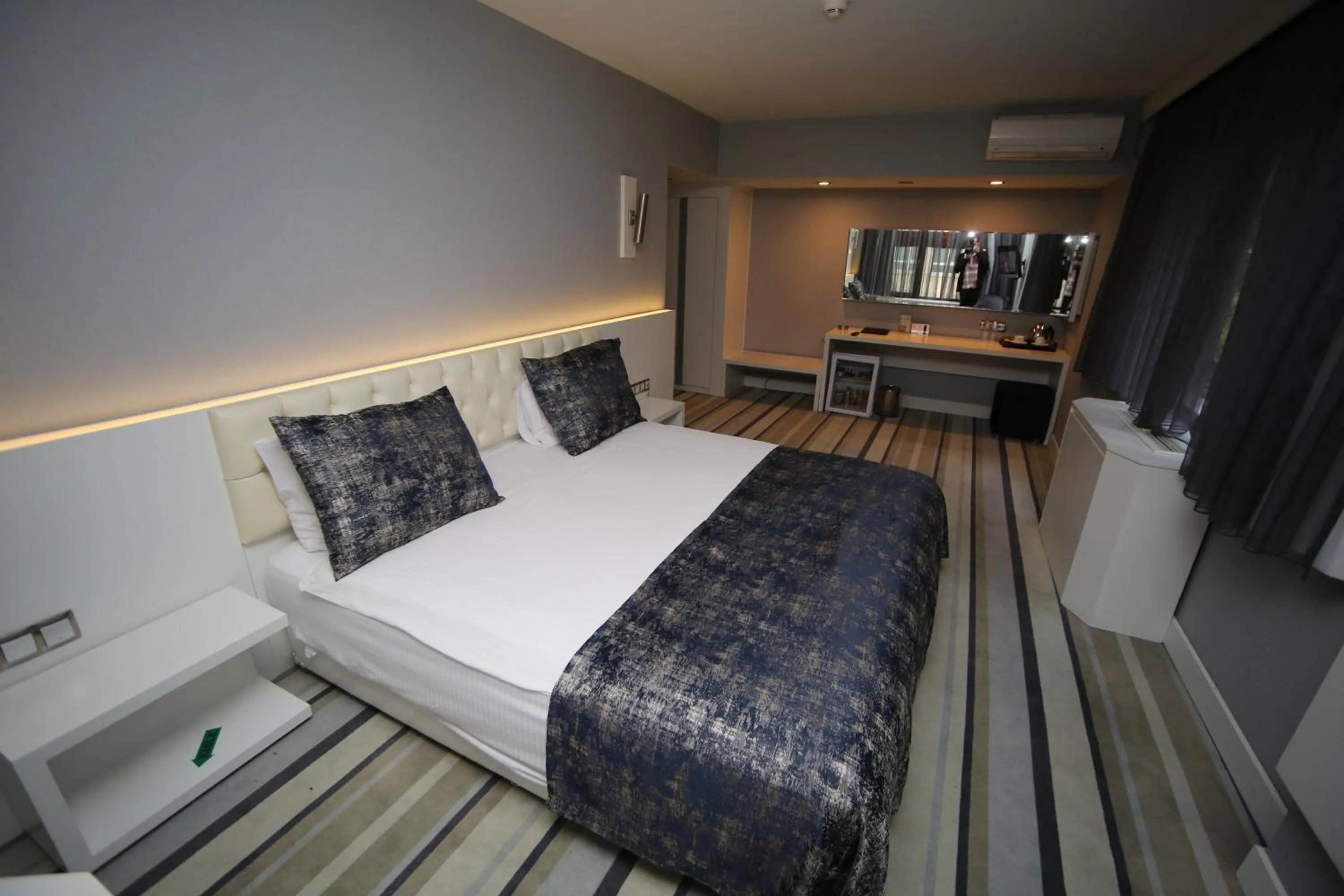 Bed in Grand Nora Hotel