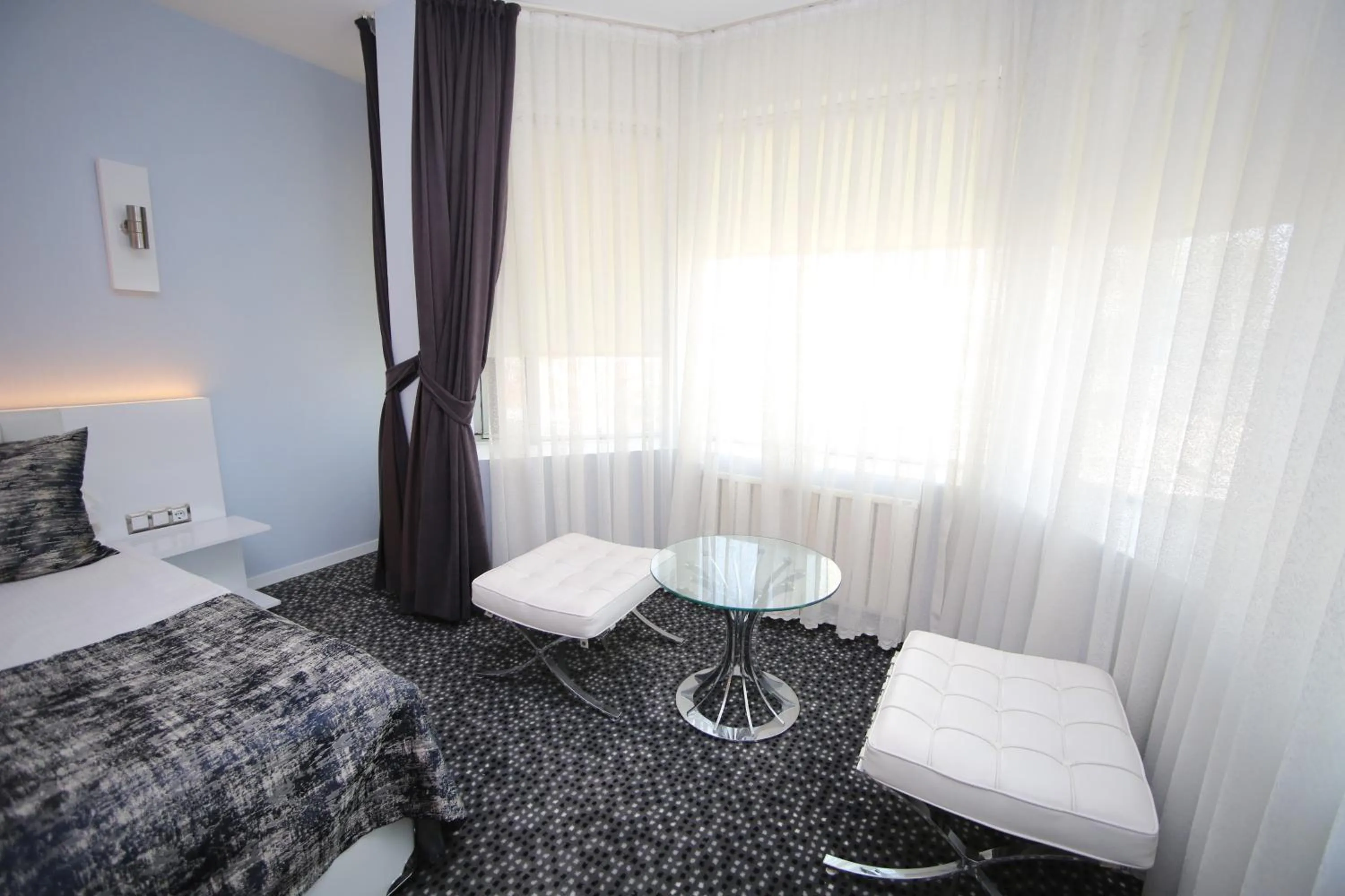 Bed in Grand Nora Hotel