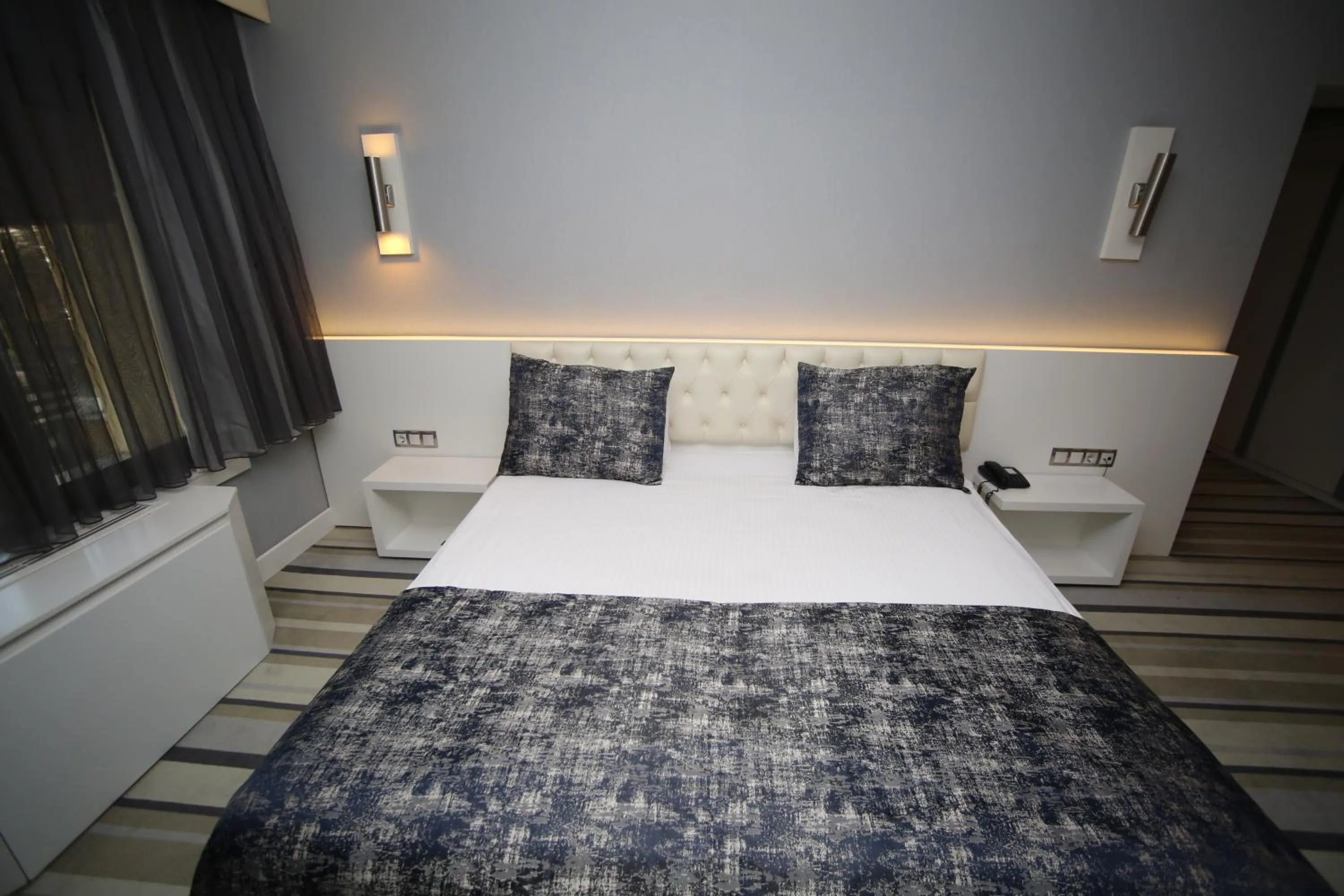 Bed in Grand Nora Hotel