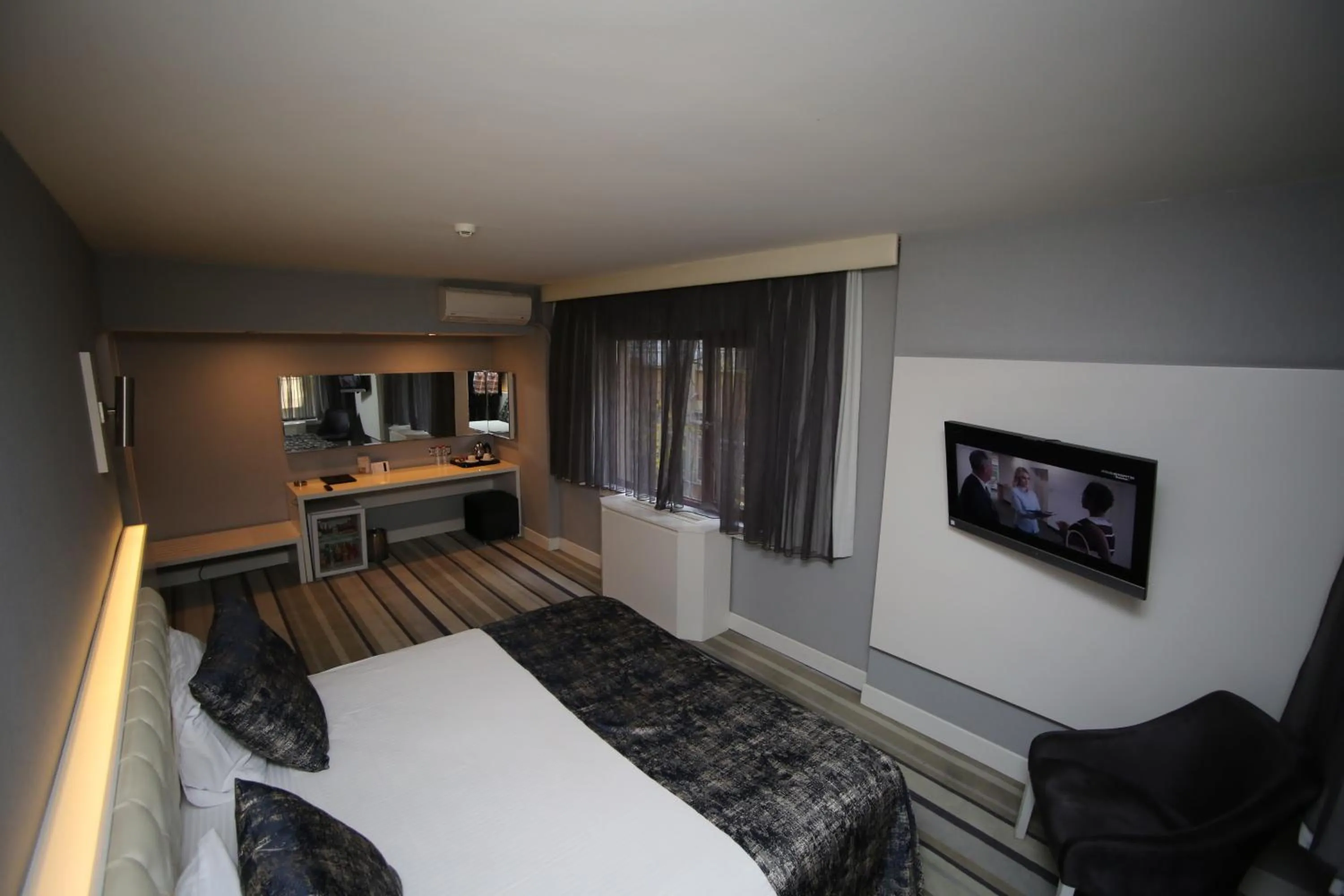 Bed in Grand Nora Hotel