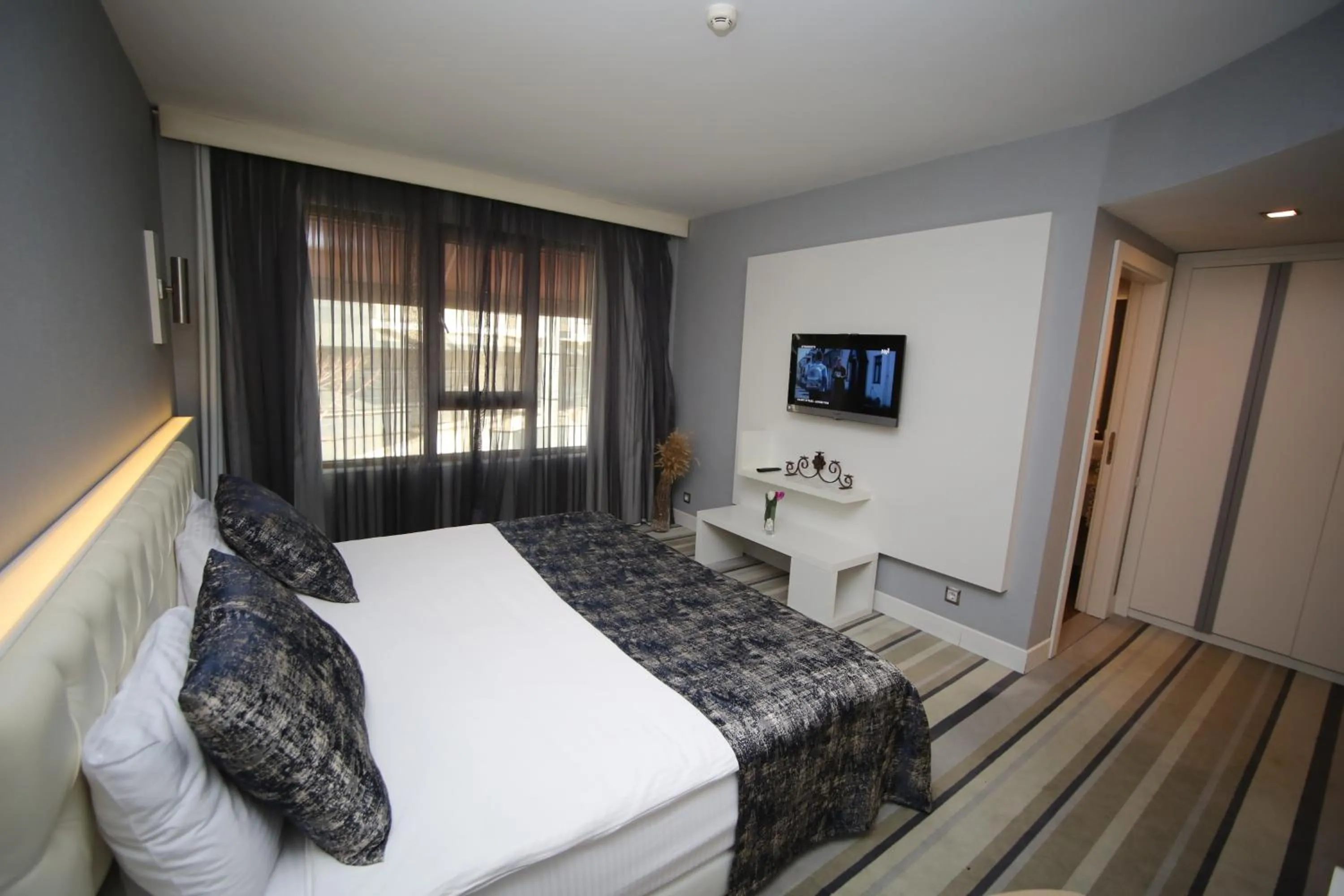 Bed in Grand Nora Hotel