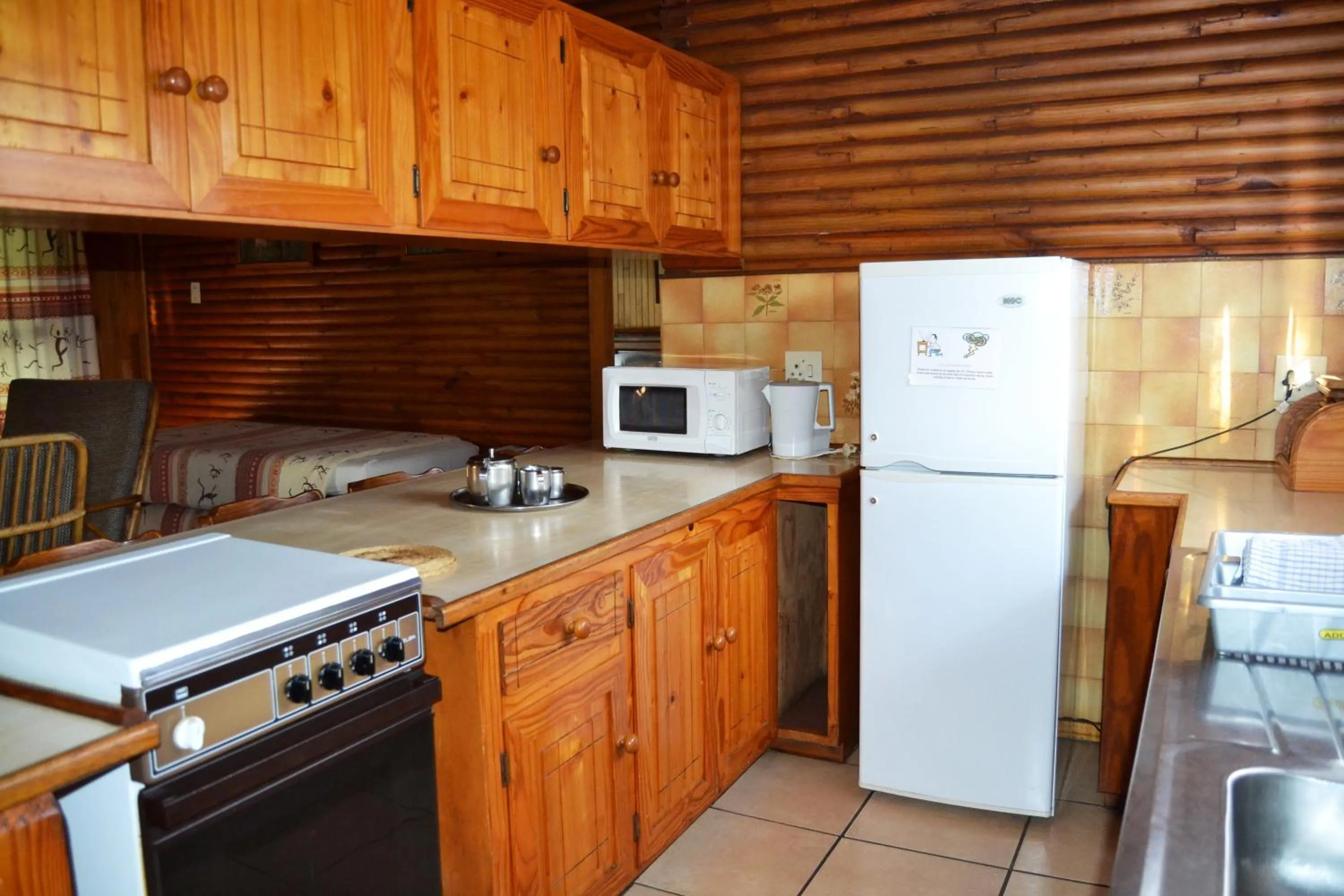 Kitchen or kitchenette in Log Cabin & Settlers Village