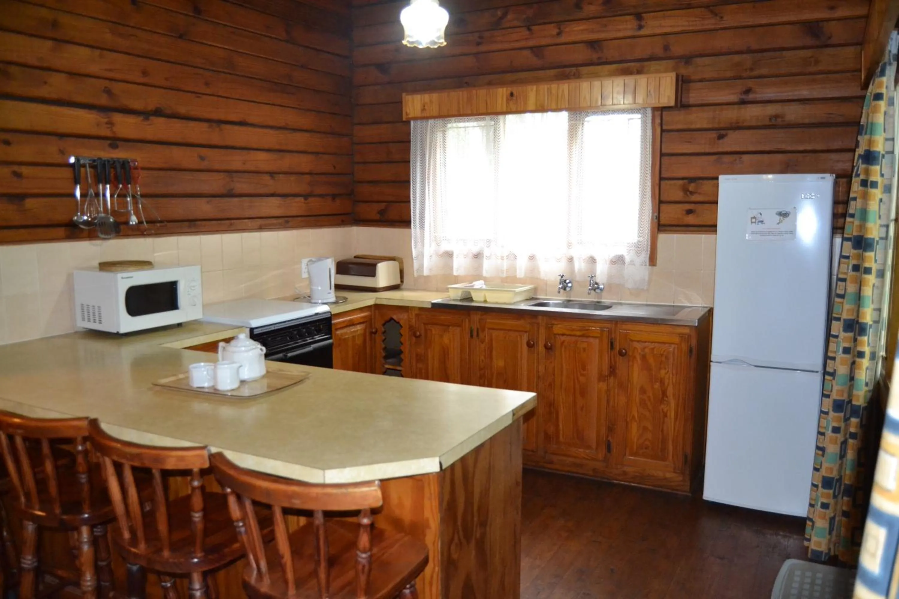Kitchen or kitchenette in Log Cabin & Settlers Village