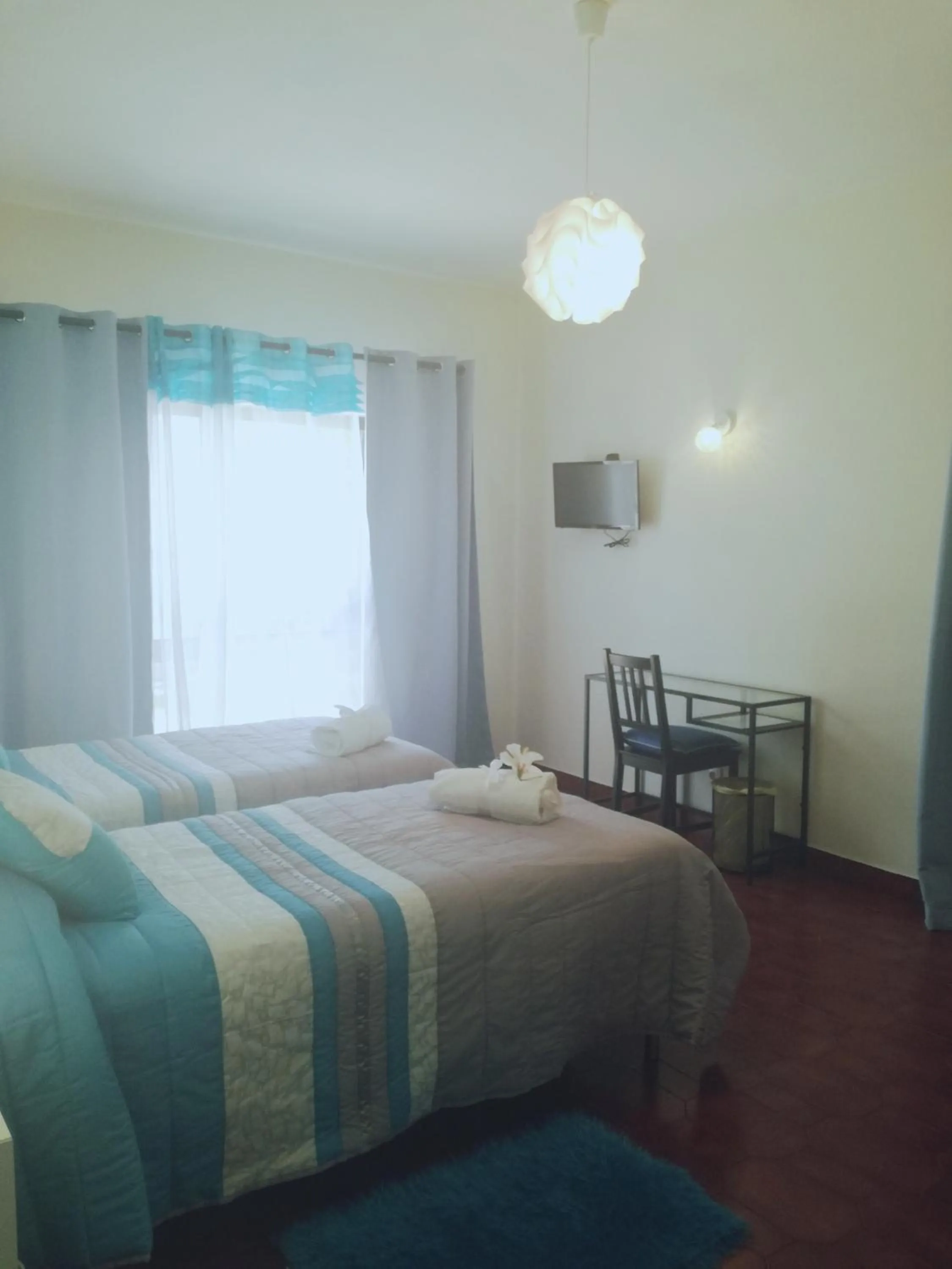 Bed in Sensations Guesthouse