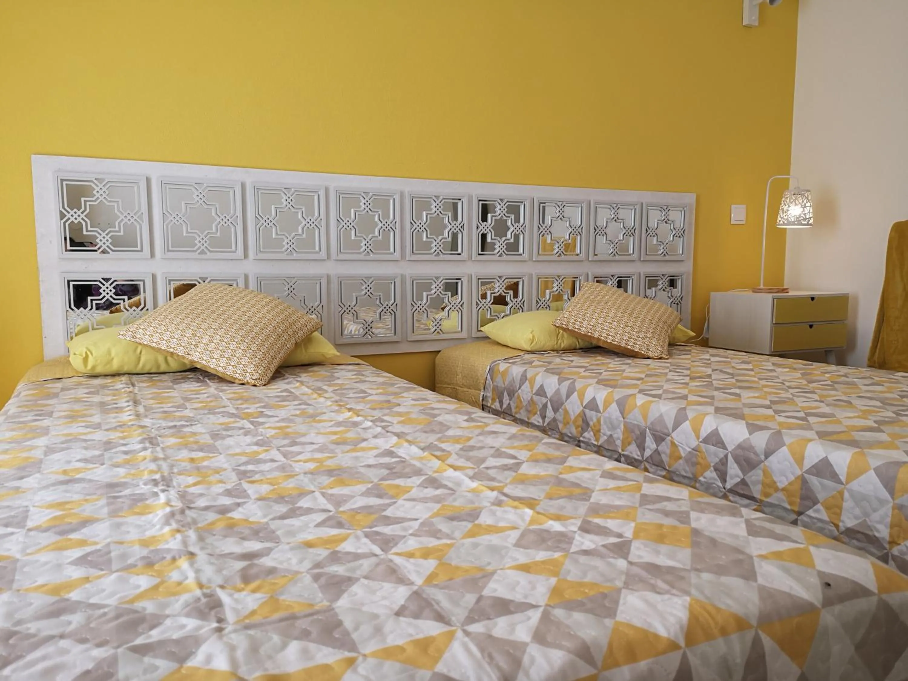 Bed in Sensations Guesthouse