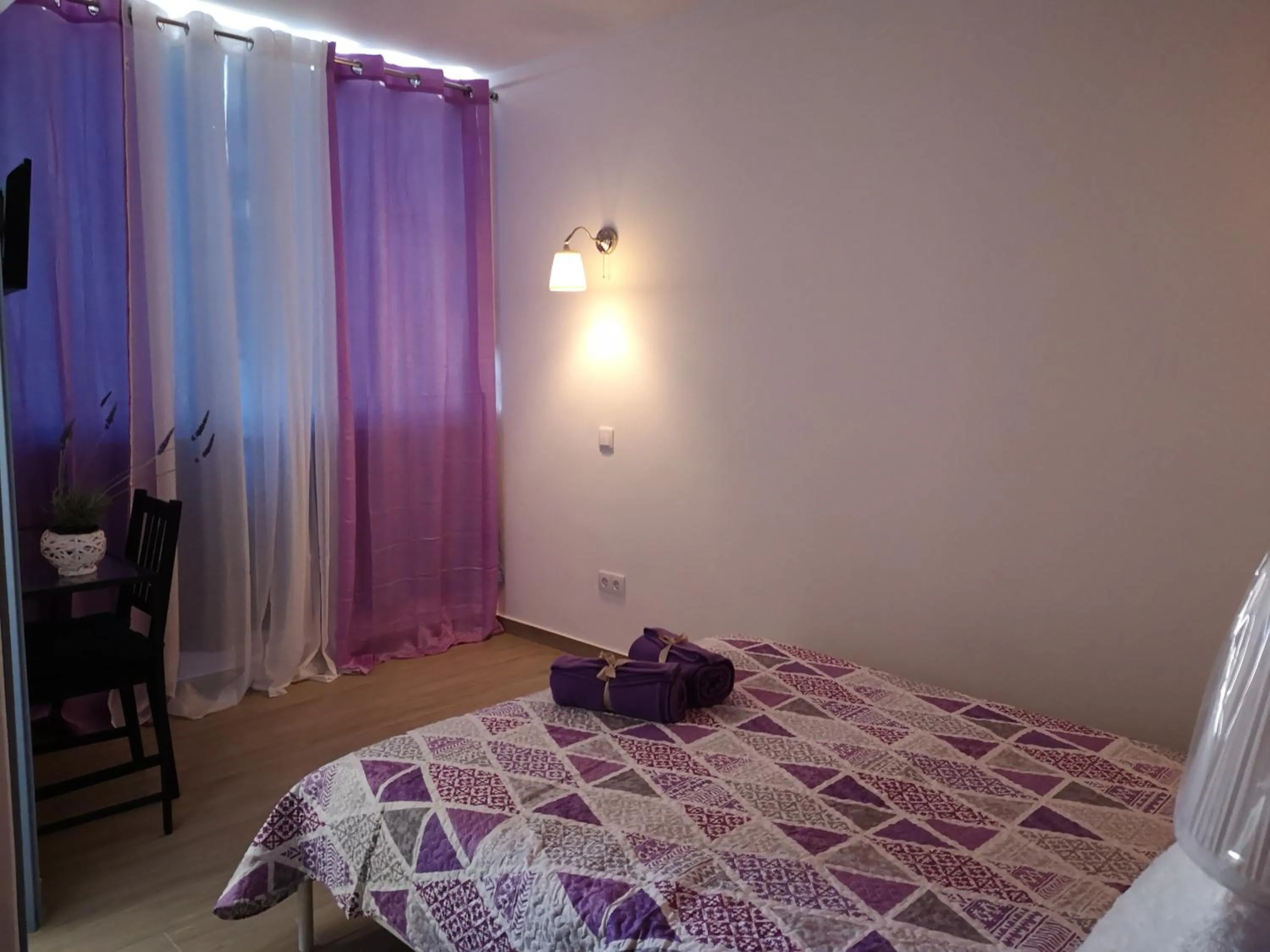 Bed in Sensations Guesthouse