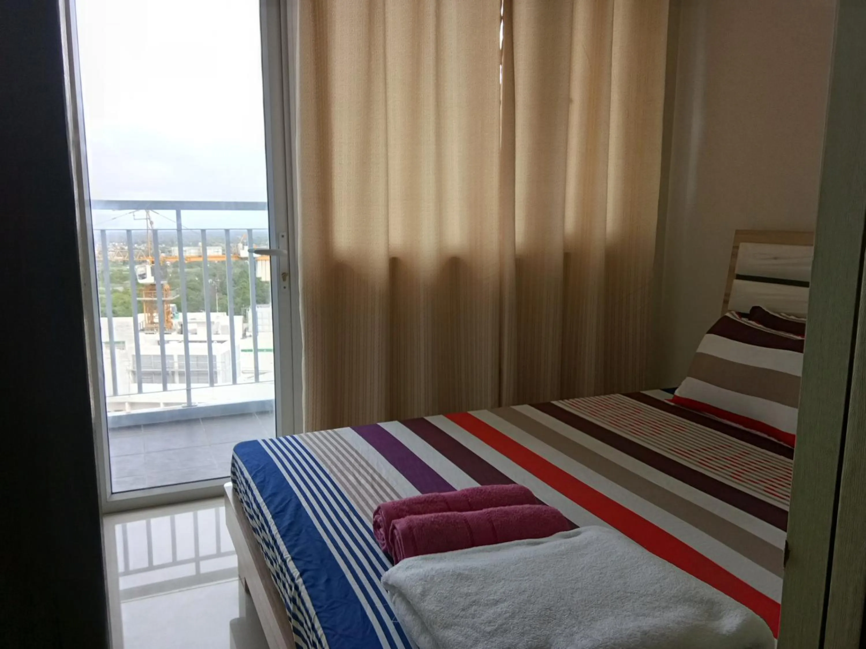 Bed in Wind Residences by SMCo