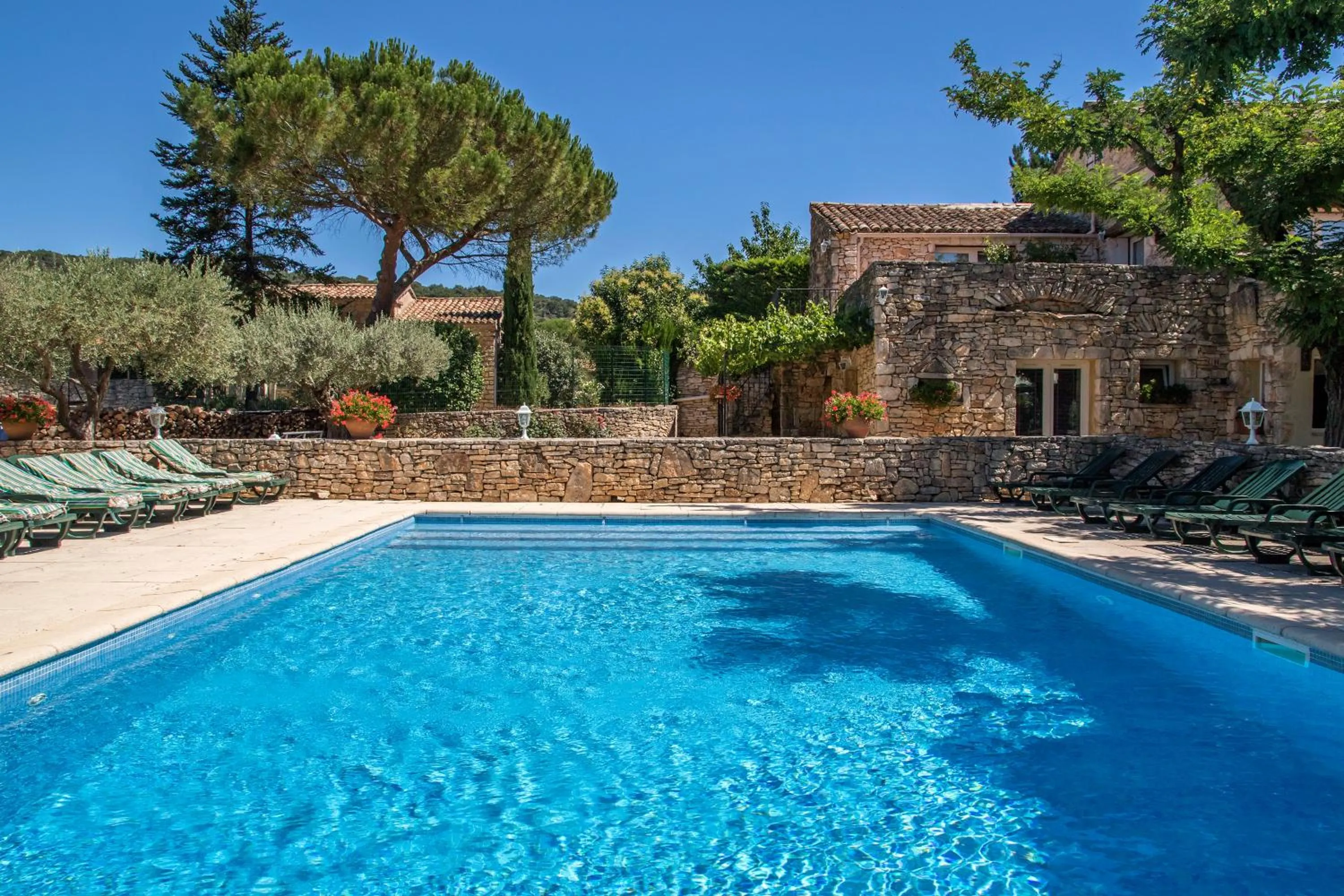 Swimming pool in Logis Hôtel Restaurant L'Escarbille