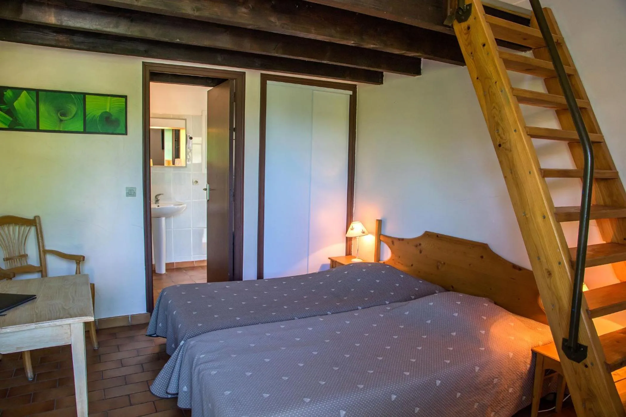 Bed in Logis Hôtel Restaurant L'Escarbille