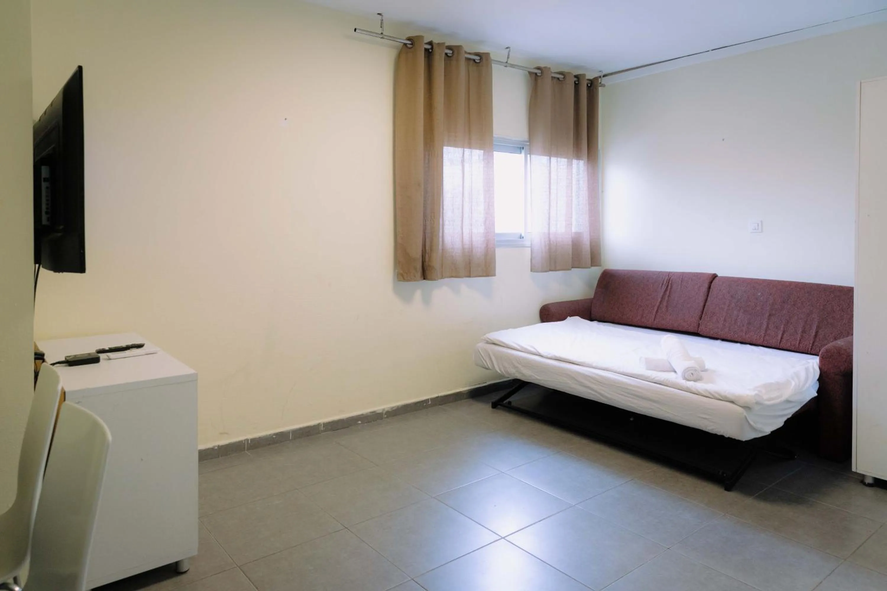 Bed in Rich Luxury Suites