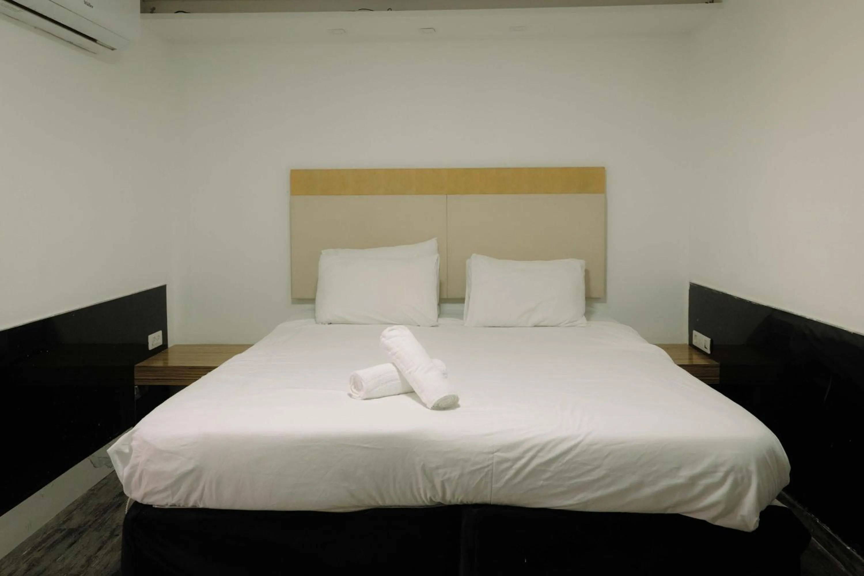 Bed in Rich Luxury Suites