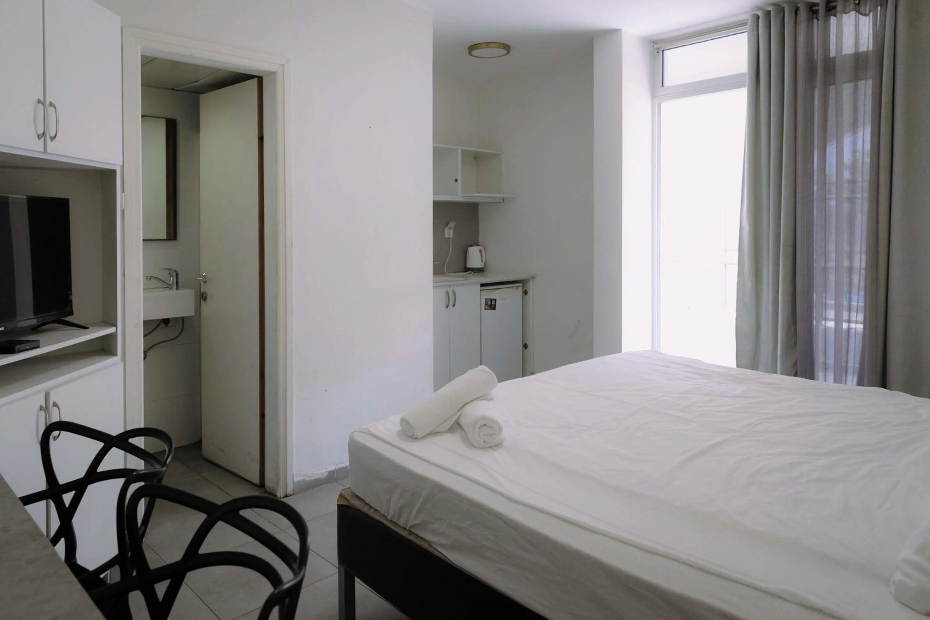 Bed in Rich Luxury Suites