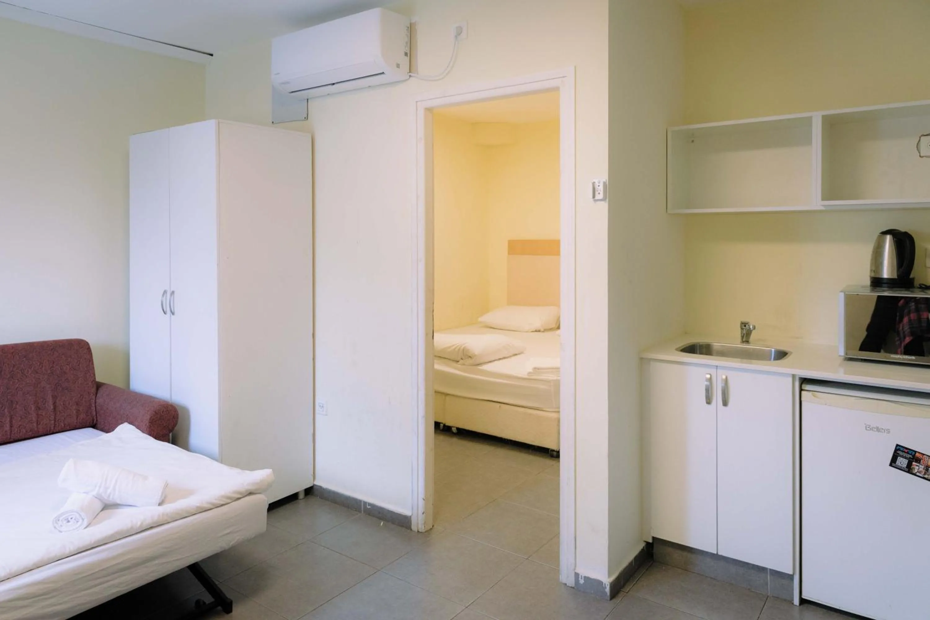 Bed in Rich Luxury Suites