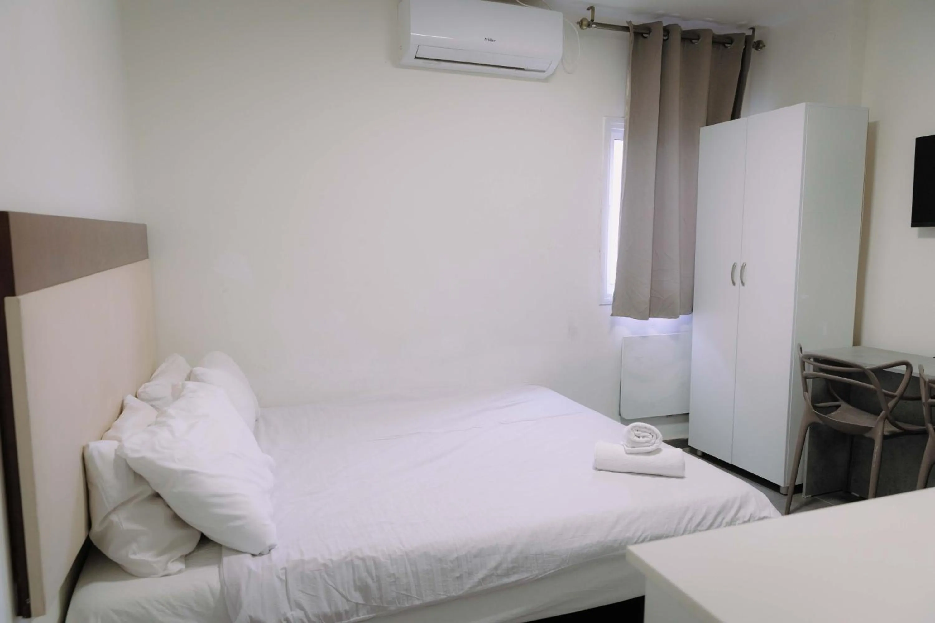 Bed in Rich Luxury Suites