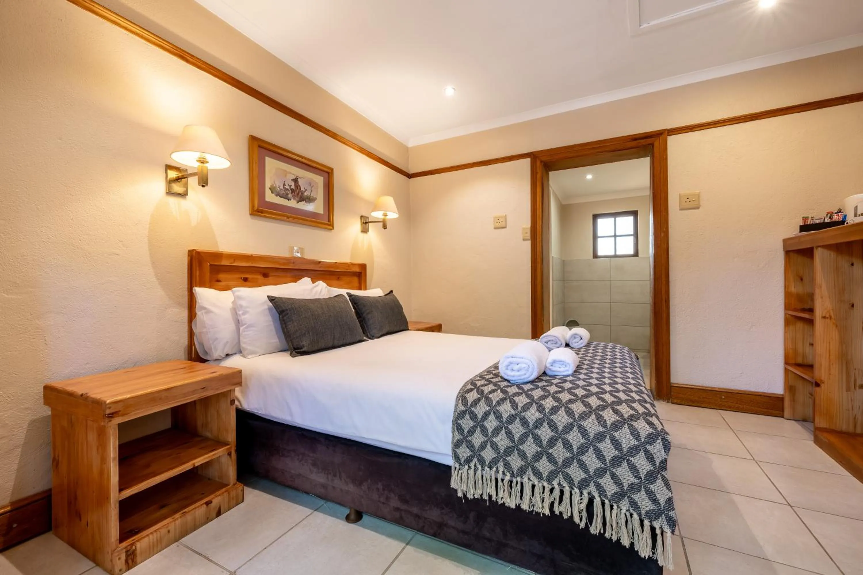 Bed in Hotel Numbi & Garden Suites