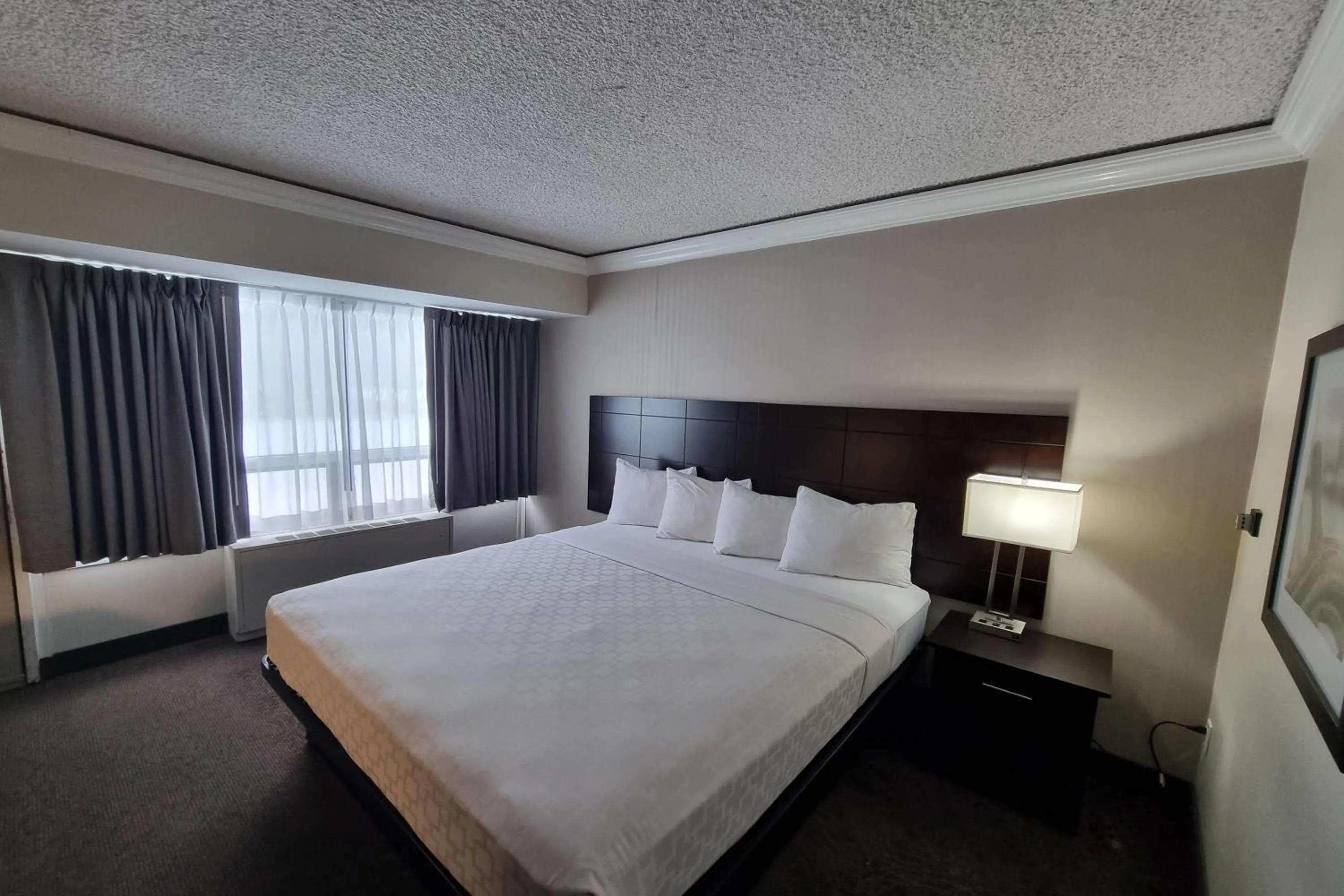 Photo of the whole room, Bed in Travelodge by Wyndham Trois-Rivieres